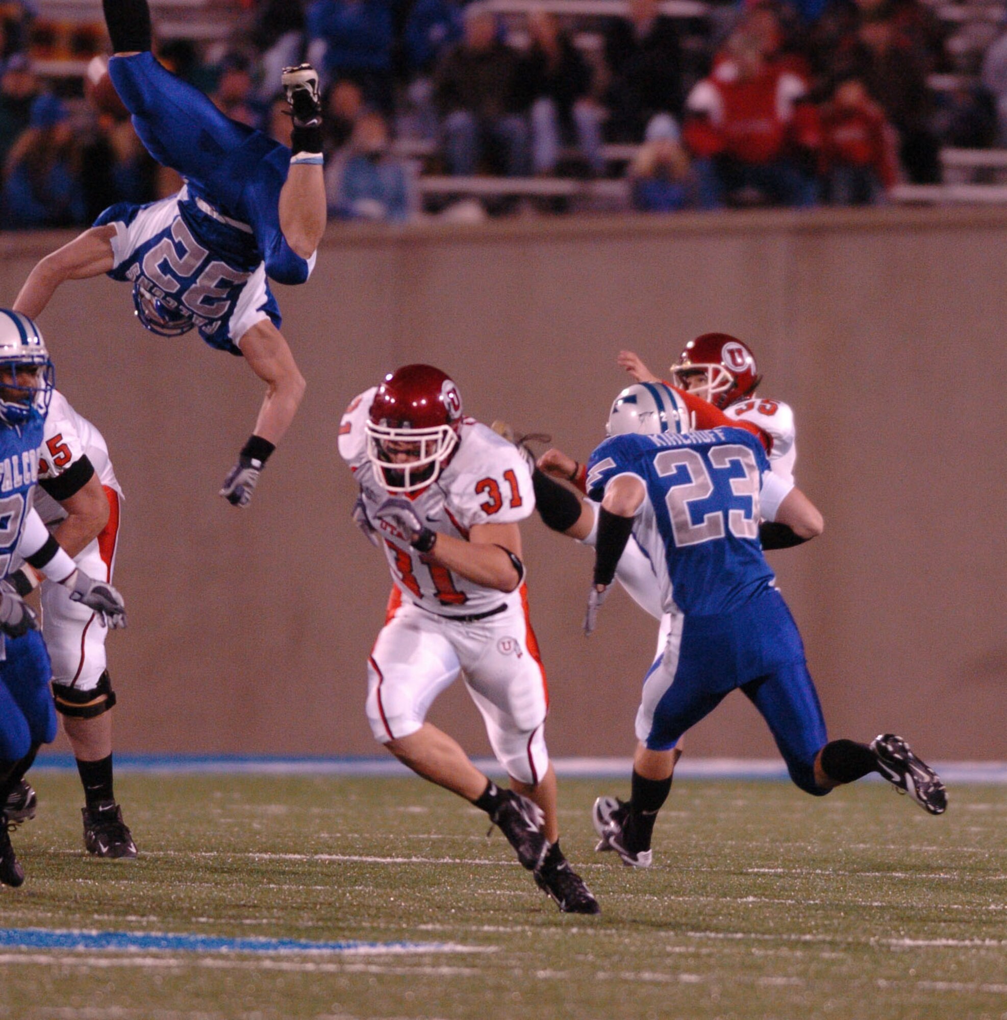 Air Force special teams player Hunter Altman gives new meaning to air power as he lofts himself over Utah defenders to attempt a punt block Nov. 18 in Colorado Springs, Colo. Ute punter Louie Sakoda averaged 45.2 yards per punt and also kicked the game winning field goal as time ran out for a 17-14 Utah win.  (U.S. Air Force photo/1st Lt. John Ross) 
