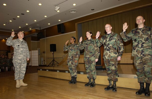 MISAWA AIR BASE, Japan -- During the enlisted call held on Nov. 9 here, command Sgt. Maj. William Gainy, the enlisted advisor to the Joint Chiefs of Staff, presented his coin to a select few Airmen. The command sergeant major spoke to the Airmen about being the best they can be.  (Photo by Senior Airman Robert Barnett)                         