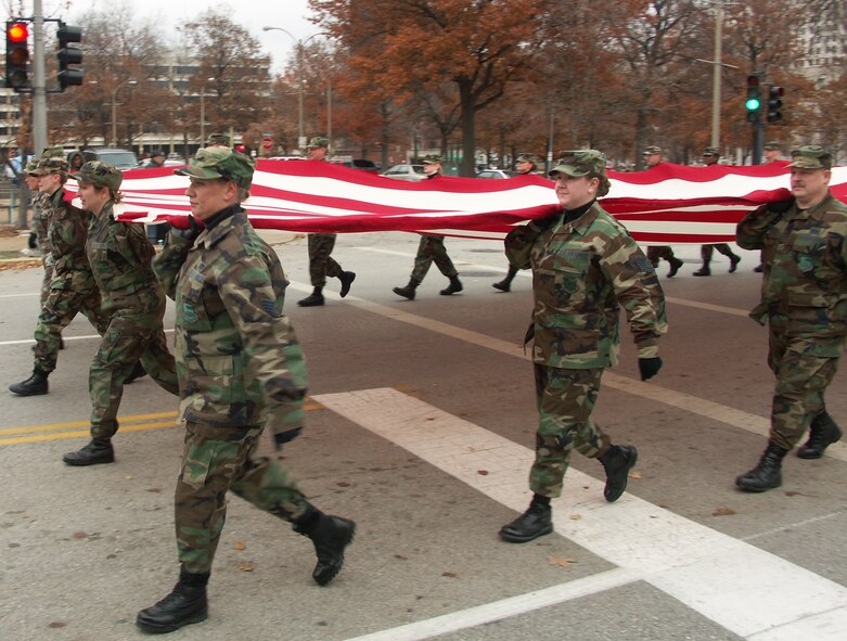 Veterans were honored by members of the 932nd Airlift Wing, Air Force Reserve Command, located at Scott Air Force Base, Ill.  They marched their huge American flag through the streets of Saint Louis on a cold, blustery, November day.  Photo/Capt. Stan Paregien

