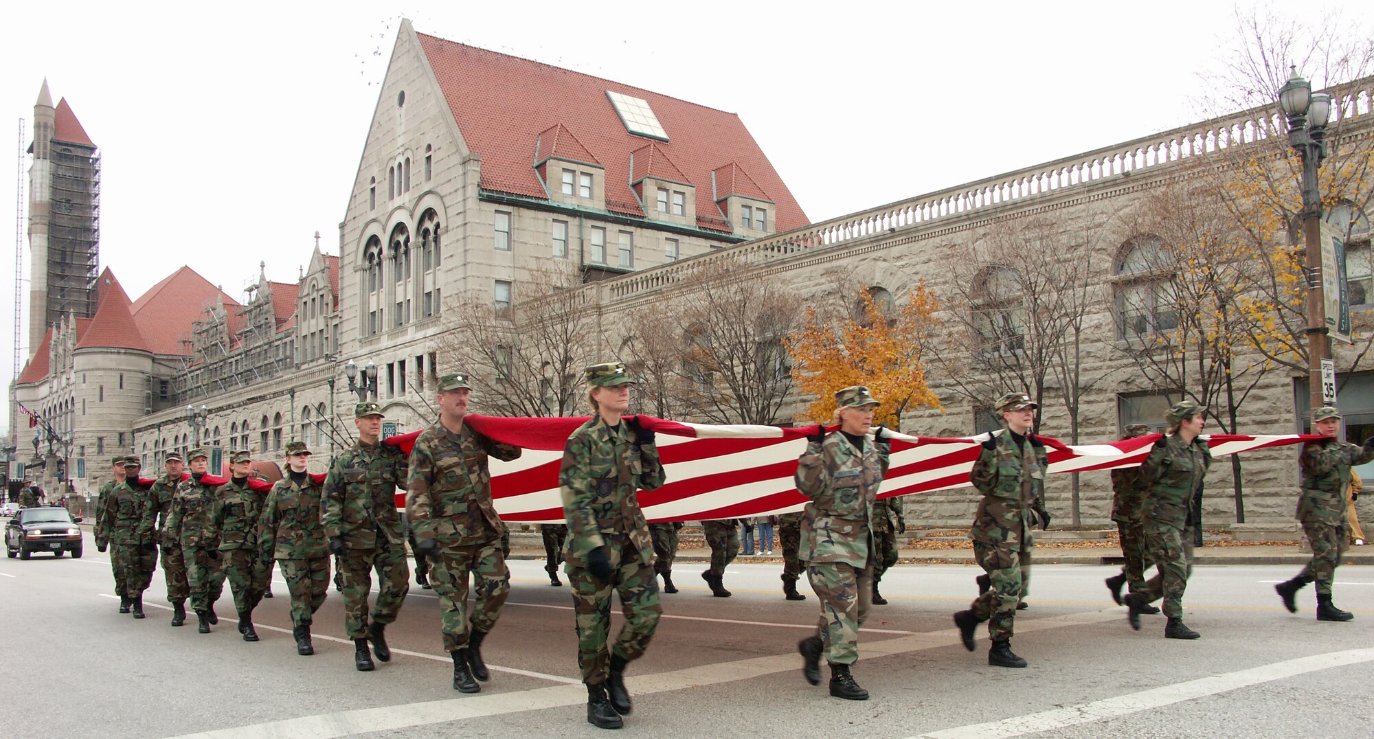 Veterans were honored by members of the 932nd Airlift Wing, Air Force Reserve Command, located at Scott Air Force Base, Ill.  They marched their huge American flag past the Hyatt Regency Hotel in Saint Louis on a cold, blustery, November day.  Photo/Capt. Stan Paregien
