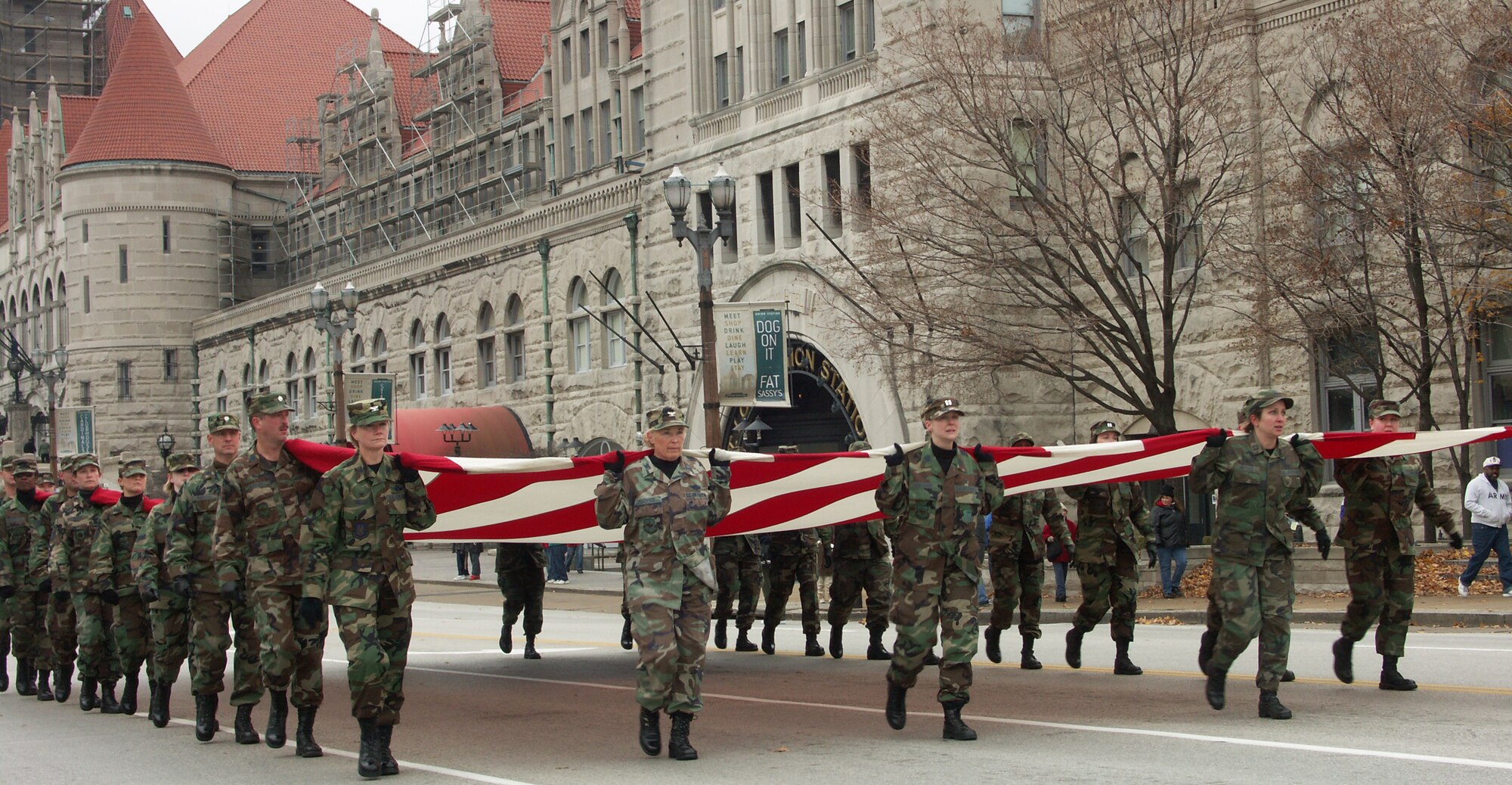 Patriotism is important to these Airmen.  Veterans were honored by members of the 932nd Airlift Wing, Air Force Reserve Command, located at Scott Air Force Base, Ill.  They marched their huge American flag through the streets of Saint Louis on a cold, blustery, November day.  Photo/Capt. Stan Paregien
