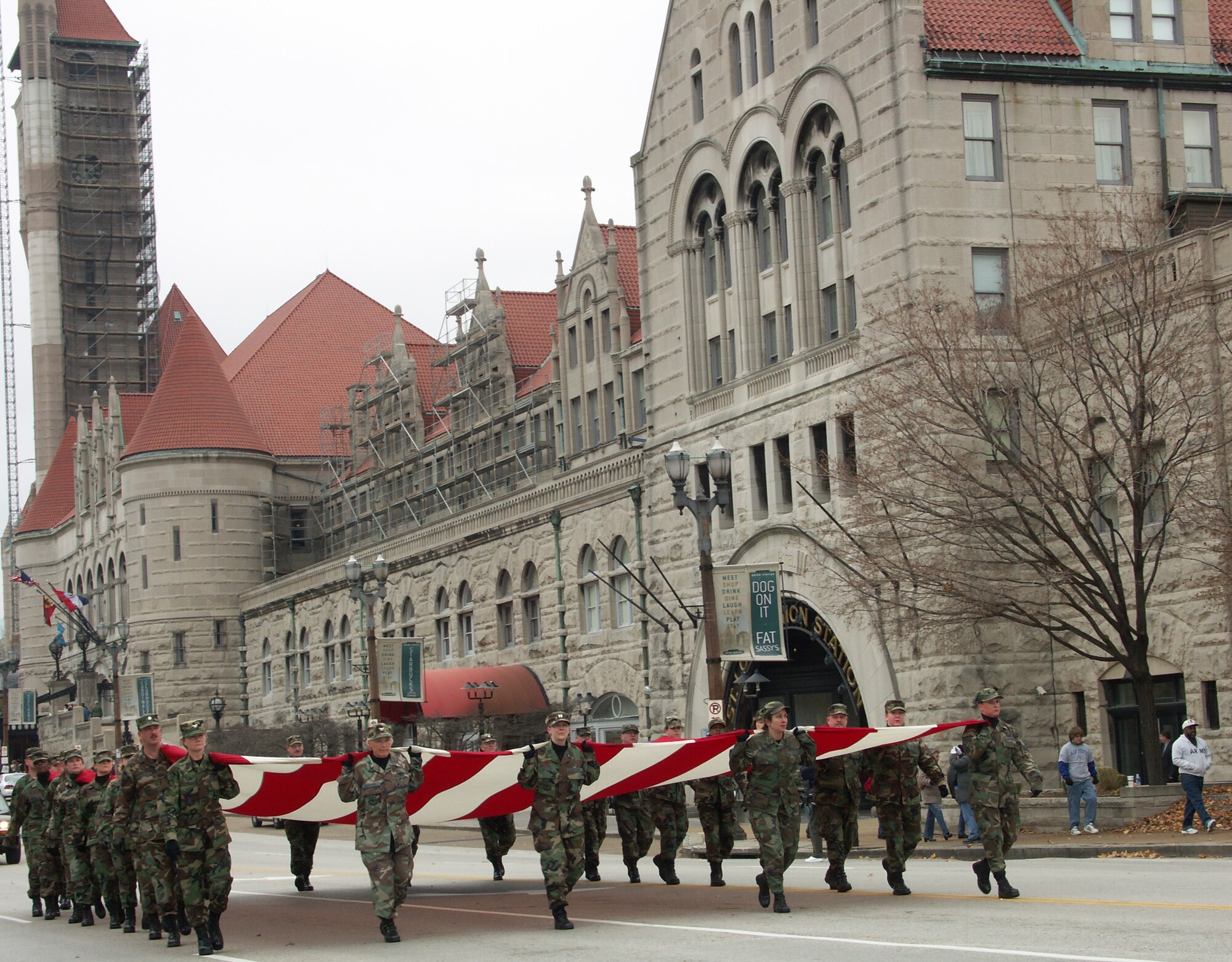 (LEFT)  Col. Maryanne Miller leads her Air Force Reserve Command Reservists down the road in the Veteran's Day Parade, 2006.  Veterans were honored by members of the 932nd Airlift Wing from Scott Air Force Base, Ill.  They marched their huge American flag through the streets of Saint Louis on a cold, blustery, November day.  Photo/Capt. Stan Paregien
