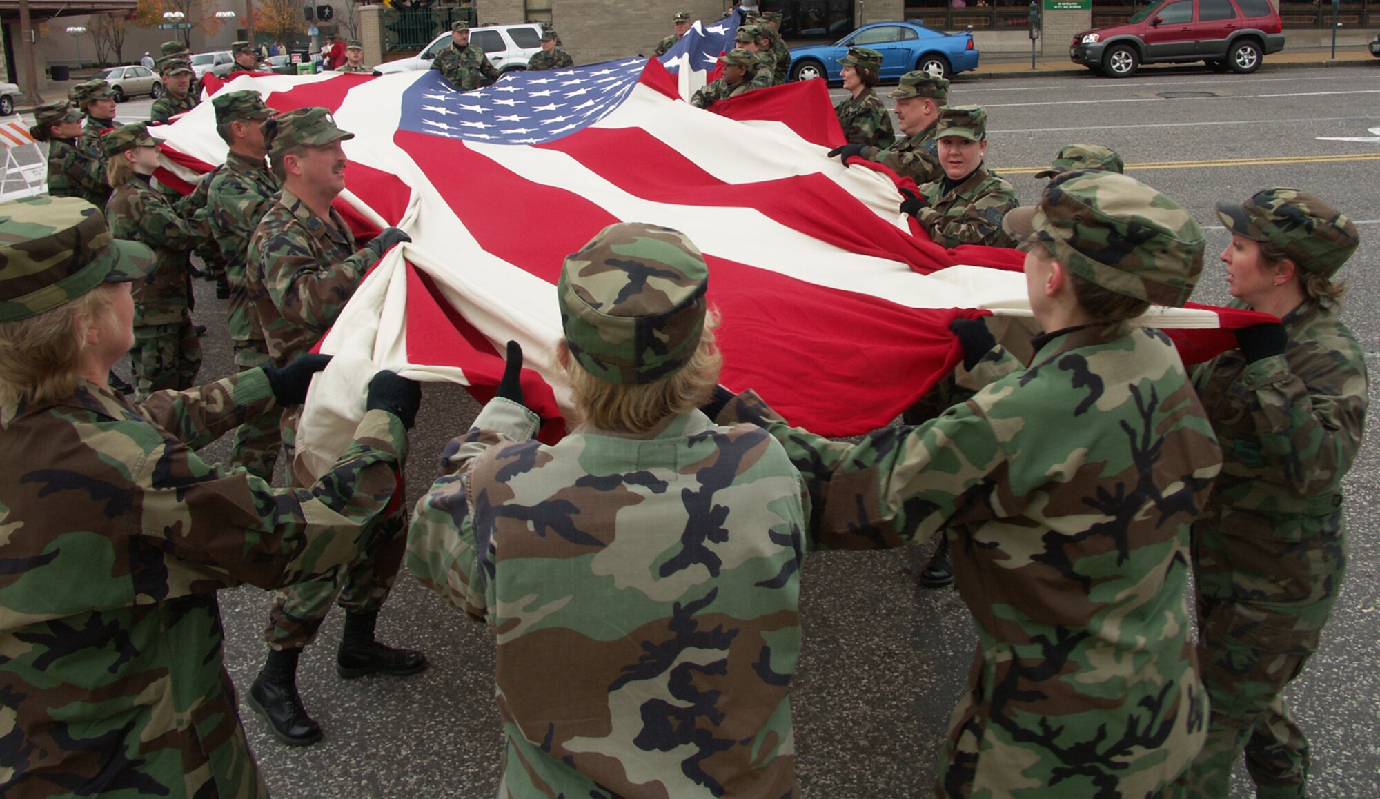 Patriotism shows as American veterans were honored by members of the 932nd Airlift Wing, Air Force Reserve Command, located at Scott Air Force Base, Ill.  They marched their huge American flag through the streets of Saint Louis on a cold, blustery, November day.  Photo/Capt. Stan Paregien
