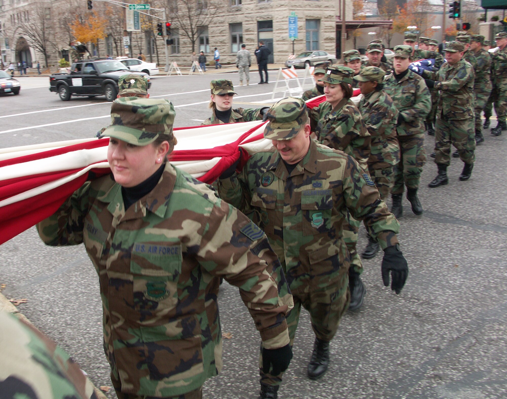 Patriotism is important to these Airmen.  Veterans were honored by members of the 932nd Airlift Wing, Air Force Reserve Command, located at Scott Air Force Base, Ill.  They marched their huge American flag through the streets of Saint Louis on a cold, blustery, November day.  Photo/Capt. Stan Paregien
