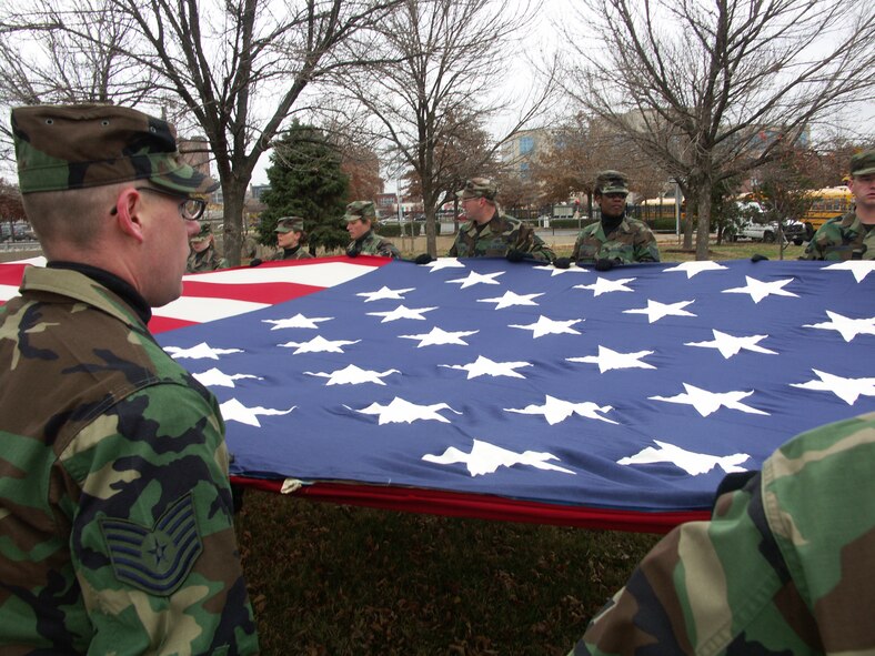 Stars make us proud...Veterans were honored by members of the 932nd Airlift Wing, Air Force Reserve Command, located at Scott Air Force Base, Ill.  They marched their huge American flag through the streets of Saint Louis on a cold, blustery, November day.  Photo/Capt. Stan Paregien
