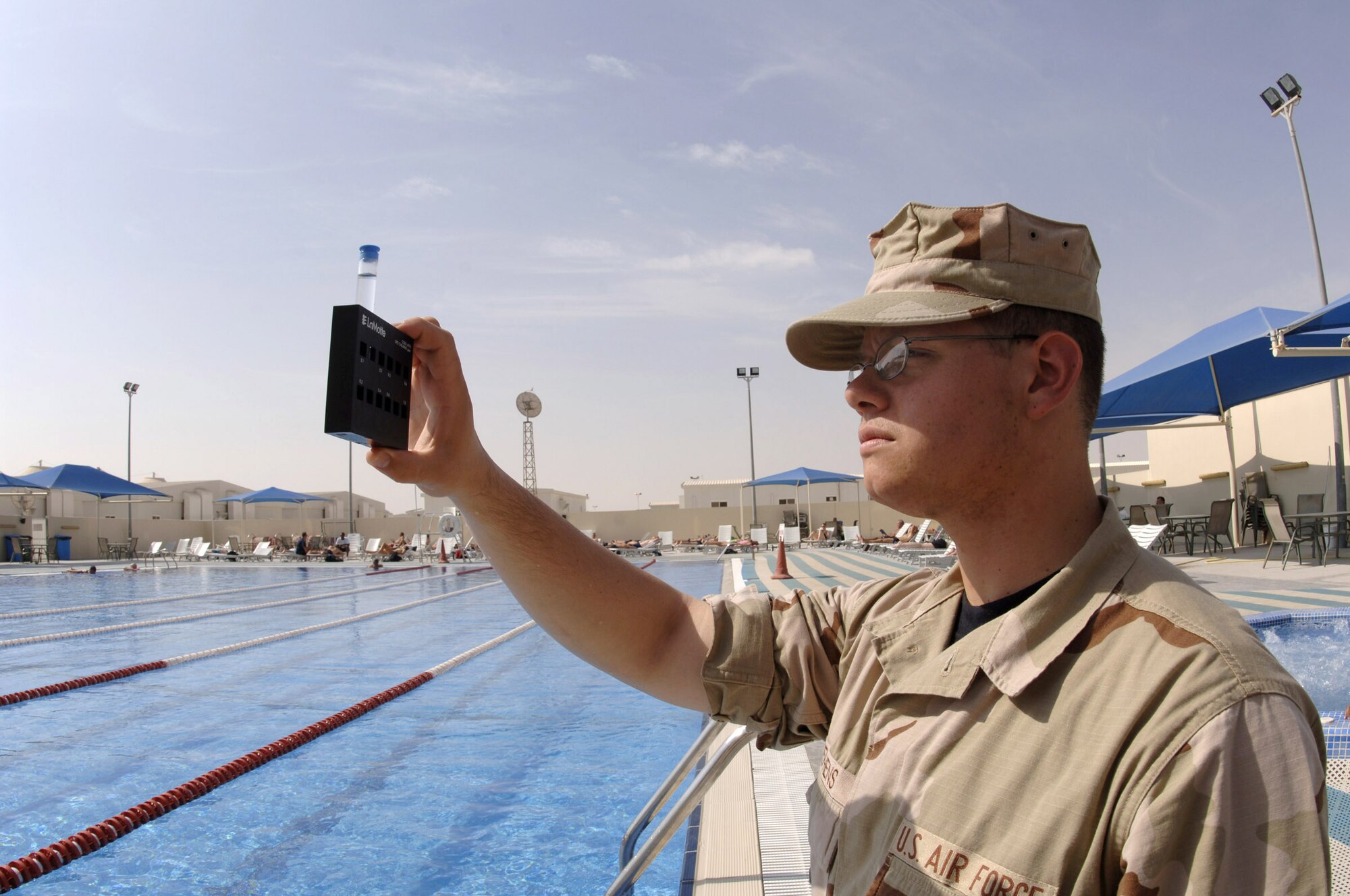 Airman 1st Class Brandon Stephens uses a chlorine kit to test pool water, which is checked weekly in Southwest Asia. Airman Stephens is a bioenvironmental engineering technician with the 379 Expeditionary Medical Group. (U.S. Air Force photo/Senior Airman Ricky Best)