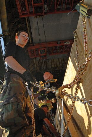 Airman 1st Class Kenneth Messick, 437 APS aerial transportation specialist, helps prepare cargo to be loaded on the AN-124 on the flight line Nov. 9. (U.S. Photo by Airman 1st Class Sam Hymas) (RELEASED)