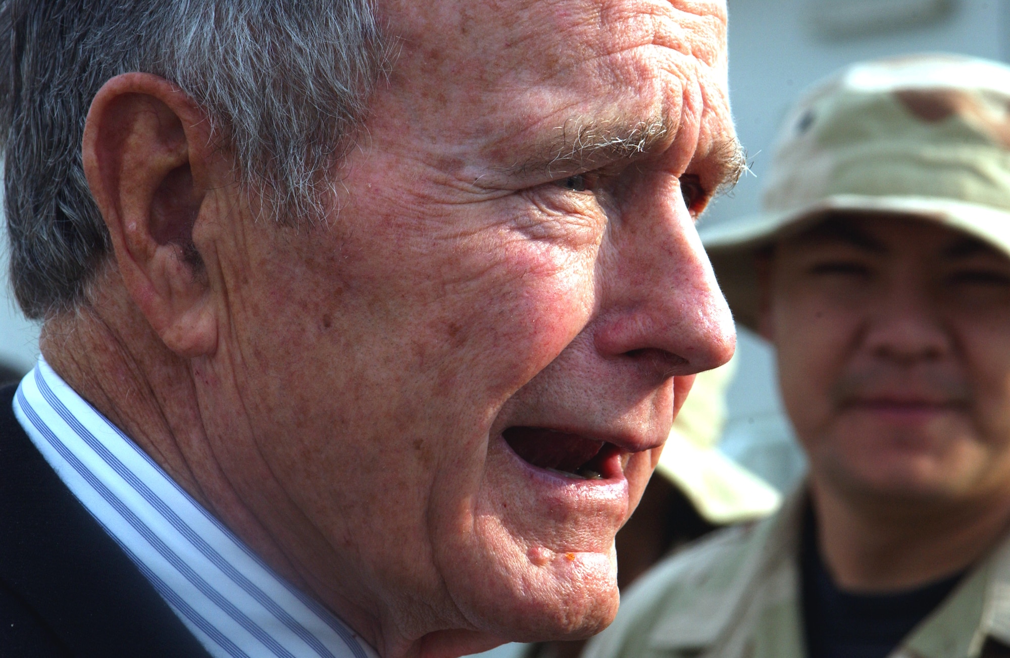 Former President of the United States George H.W. Bush talks with Airmen Nov. 20 during a visit to the 380th Air Expeditionary Wing in Southwest Asia. President Bush stopped by the wing to listen to a mission briefing and meet the Airmen assigned here. (U.S. Air Force photo/Master Sgt. Jason Tudor)