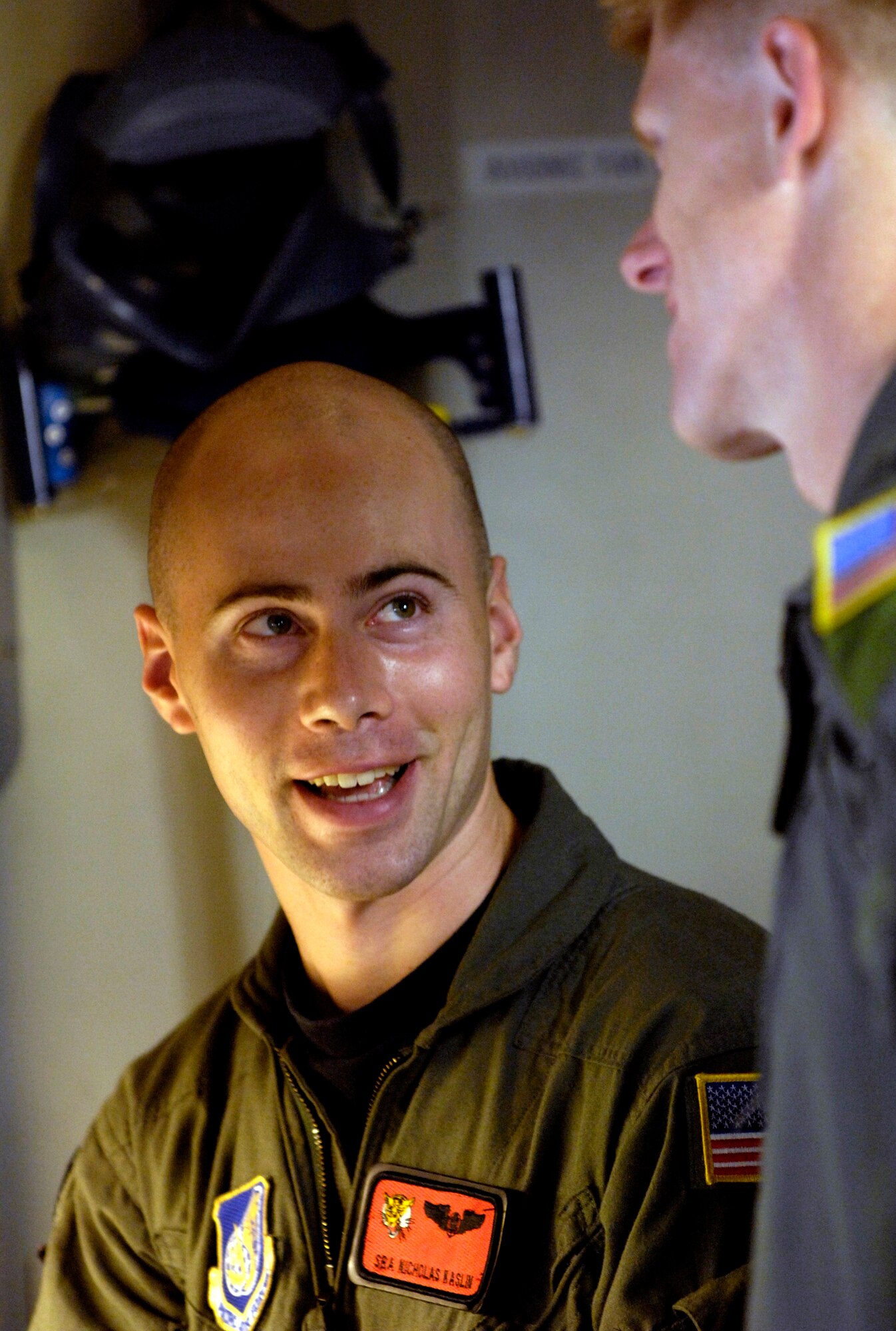 Senior Airman Nick Kaslin talks with Capt. Paul Theriot Nov. 15 before taking off on a local training mission in their C-17 Globemaster III from Hickam Air Force Base, Hawaii. The Airmen are from the 535th Airlift Squadron. (U.S. Air Force photo/Tech. Sgt. Shane A. Cuomo)
