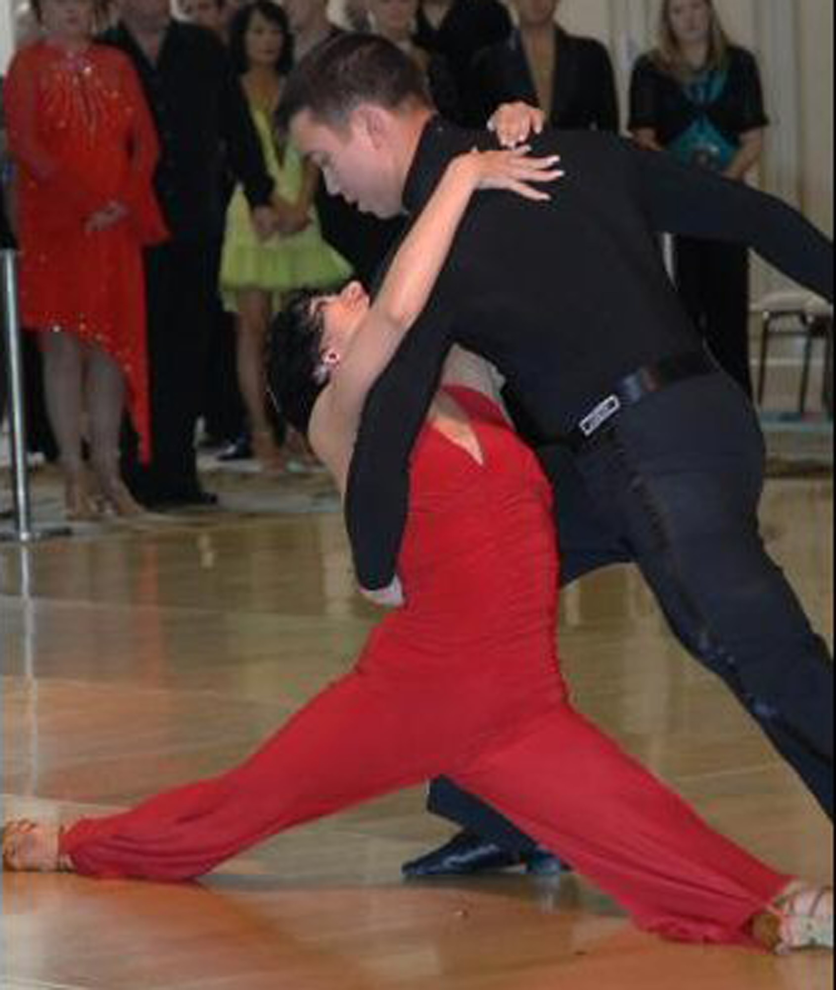 1st. Lt. John Scheuren, 28th Test and Evaluation Squadron, with partner and instructor Georgia Ambarian during a recent competition in which he won first place in three categories.