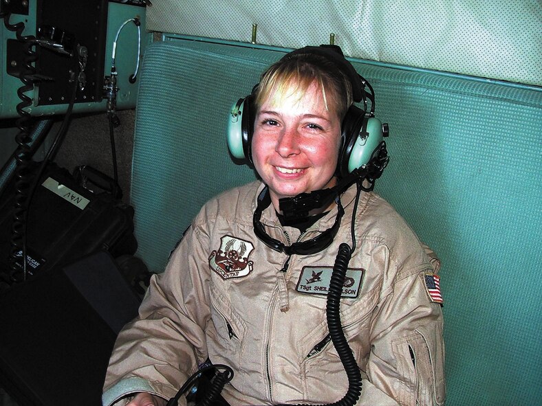 Tech. Sgt. Sheila Wilson, deployed from the 28th Security Forces Squadron, Ellsworth AFB, S.D., rides on board a C-130 Hercules and listens in to aircrew communications during the flight. Sergeant Wilson is one of nine security forces members from Ellsworth who received fly away security team training prior to deploying. FAST missions are designed to provide the mandatory security level for Air Force aircraft even though the specific mission may require the airplane to land at remote and undisclosed locations. (Courtesy photo)