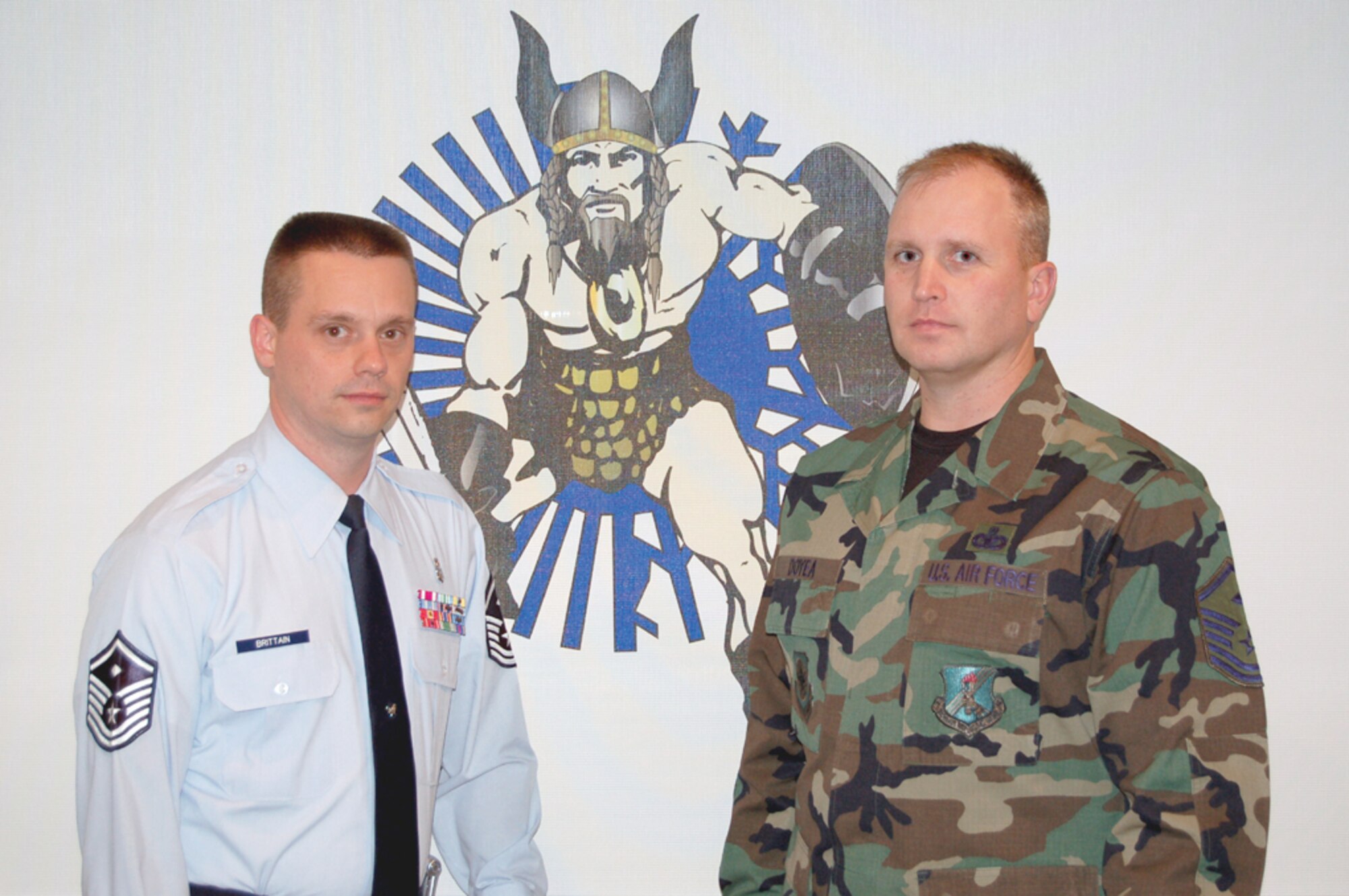 GRAND FORKS AFB, N.D. -- (left to right) Master Sgt. Timothy Brittain, 319th Maintenance Squadron first sergeant and Master Sgt. Thomas Doyea, 319th Mission Support first sergeant, saved the life of an Airman during the Airmen’s Appreciation Dinner at the dining facility here Nov. 14. (photo/Airman First Class Ashley Coomes) 