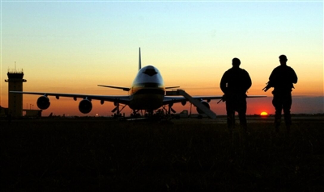 Two security forces airmen patrol the runway at Incirlik Air Base, Turkey, Nov. 17, 2006. More than half of all air cargo delivered to support Operation Iraqi Freedom is processed through here. Due to the close proximity of Incirlik to Iraq and the ability to land at more and smaller runways, flights from here have kept at least 3,300 convoy trucks and 9,000 servicemembers from harm's way.