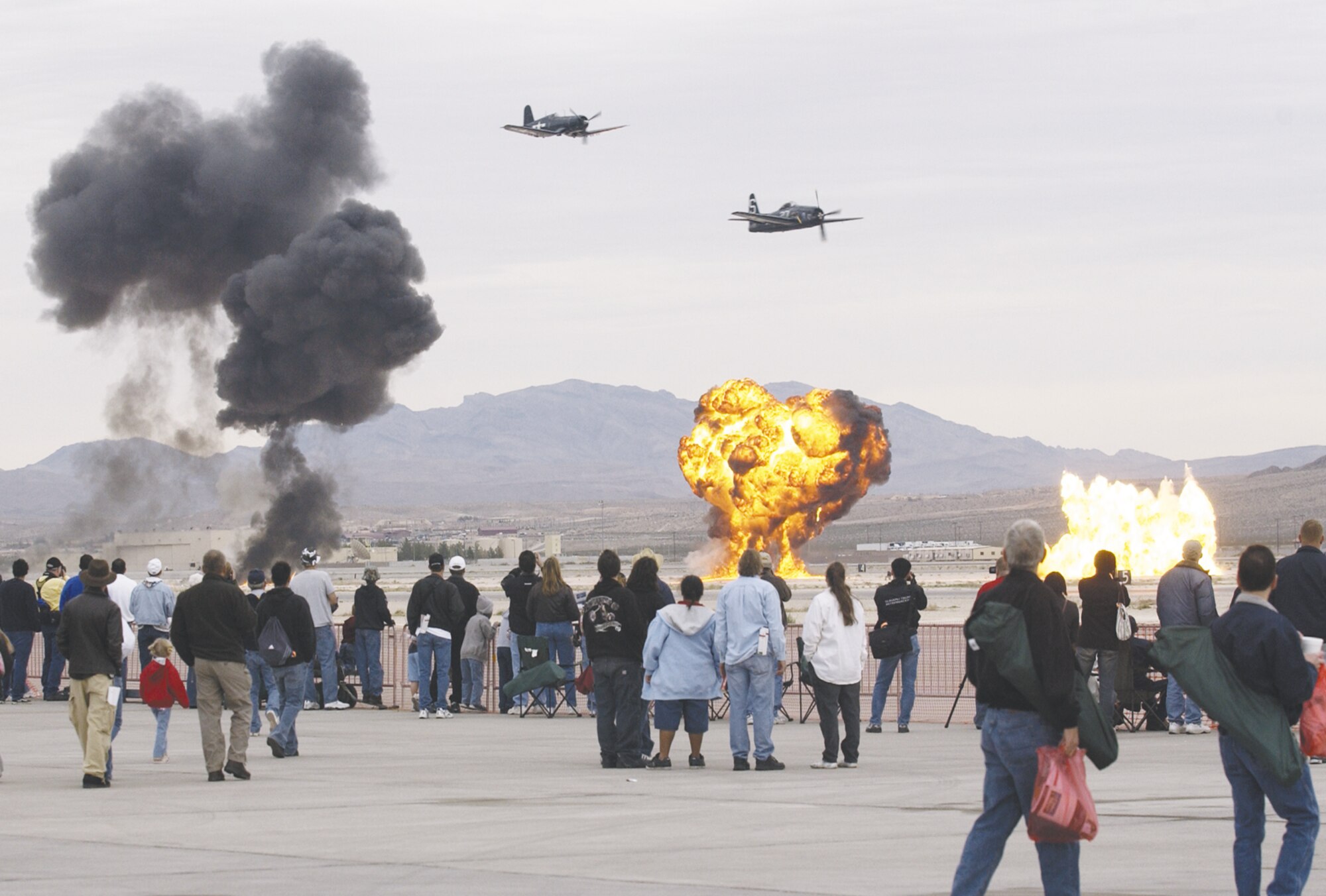 The 2006 Nellis Air Force Base air show included a Korean War demonstration. Making a bombing run are an F-4U Corsair and F-8F Bearcat. (U.S. Air Force photo/Master Sgt. Kevin Gruenwald)