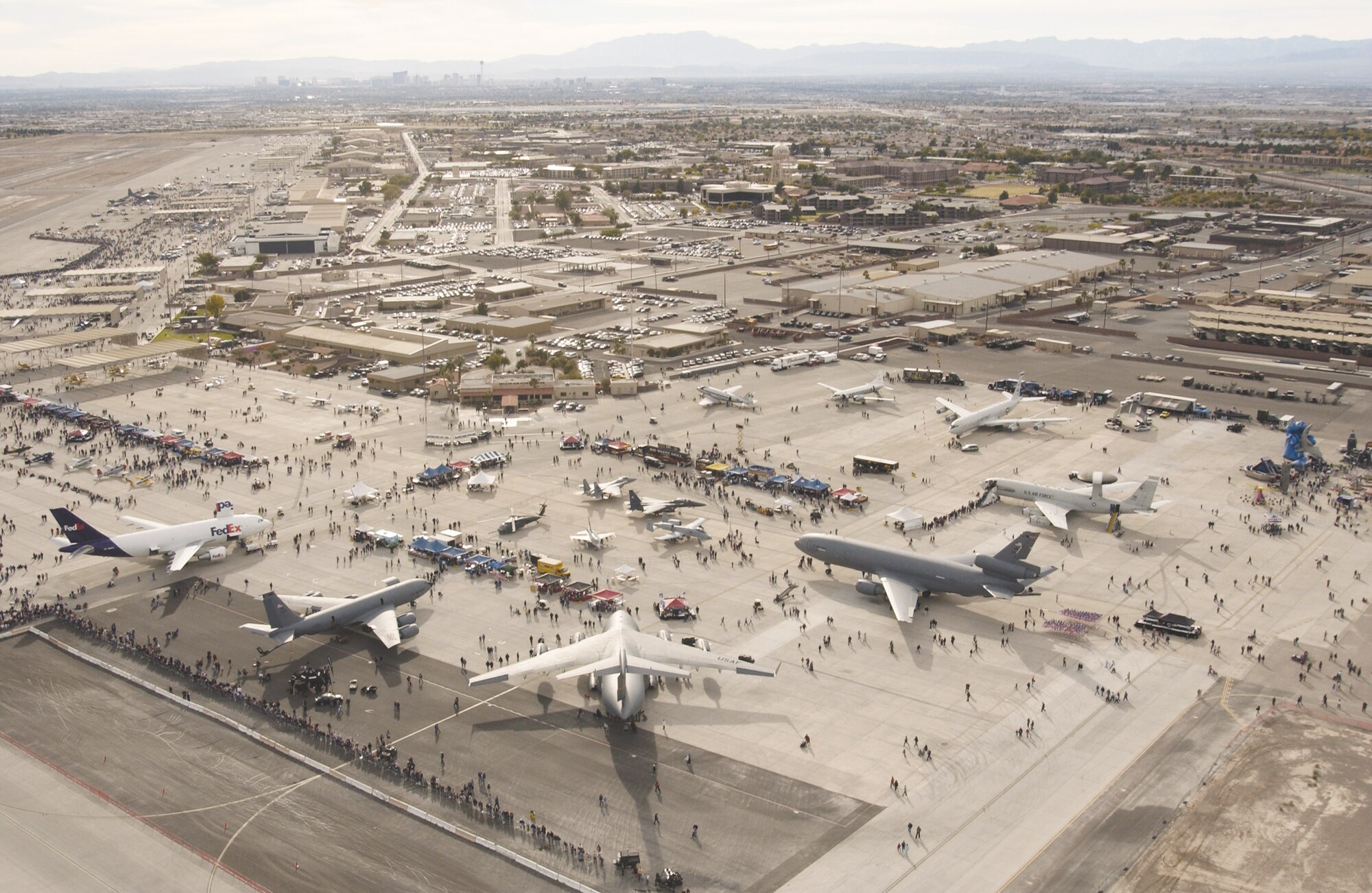 An aerial view of the Nellis flightline shows some of the more than 100 aircraft on display, as well as the city of Las Vegas on the horizon. (U.S. Air Force photo/Master Sgt. Kevin Gruenwald)