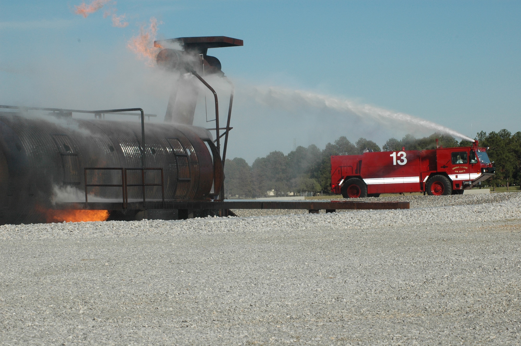 908th AW firefighting crews extinguish a controlled, simulated aircraft fire. Air Force Reserve volunteers lent resources, talents and time to the Maxwell community's large-scale effort hosting nearly 700 Scouts, leaders and demonstration teams from across the state. (U.S. Air Force Photo by Mr. Jeff Melvin)
