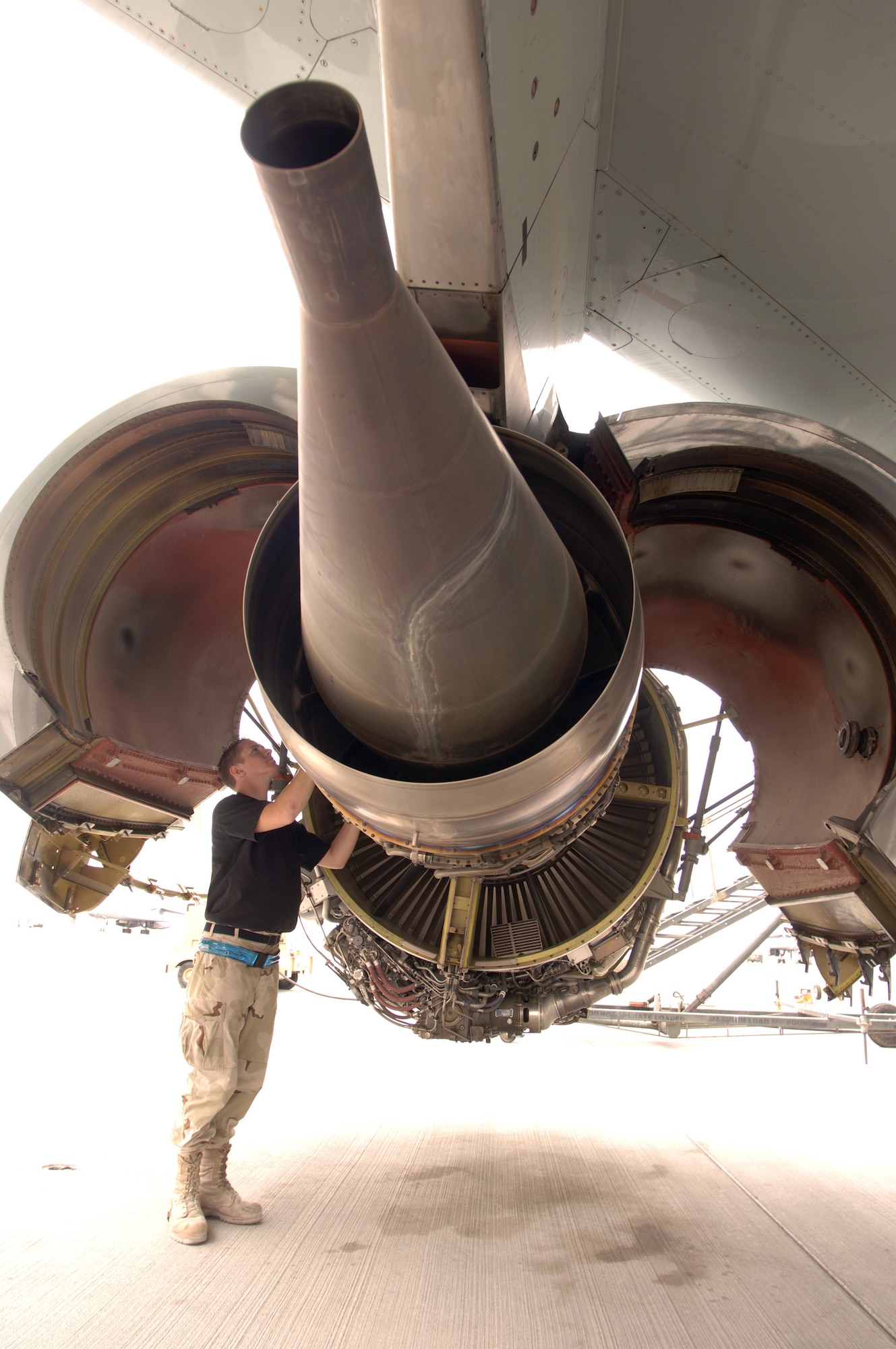 Airman Mark Magill inspects the number two engine on an RC-135 Rivet Joint in Southwest Asia. The F108-model high bypass turbofan engine, introduced to the 135-airframe in August of 1998, has proven to be a reliable workhorse in transporting the heavy 275,000-pound intelligence and reconnaissance platform. Airman Magill is a jet engine mechanic deployed from the 55th Aircraft Maintenance Squadron from Offutt Air Force Base, Neb. (U.S. Air Force photo/Master Sgt. Scott Wagers)
