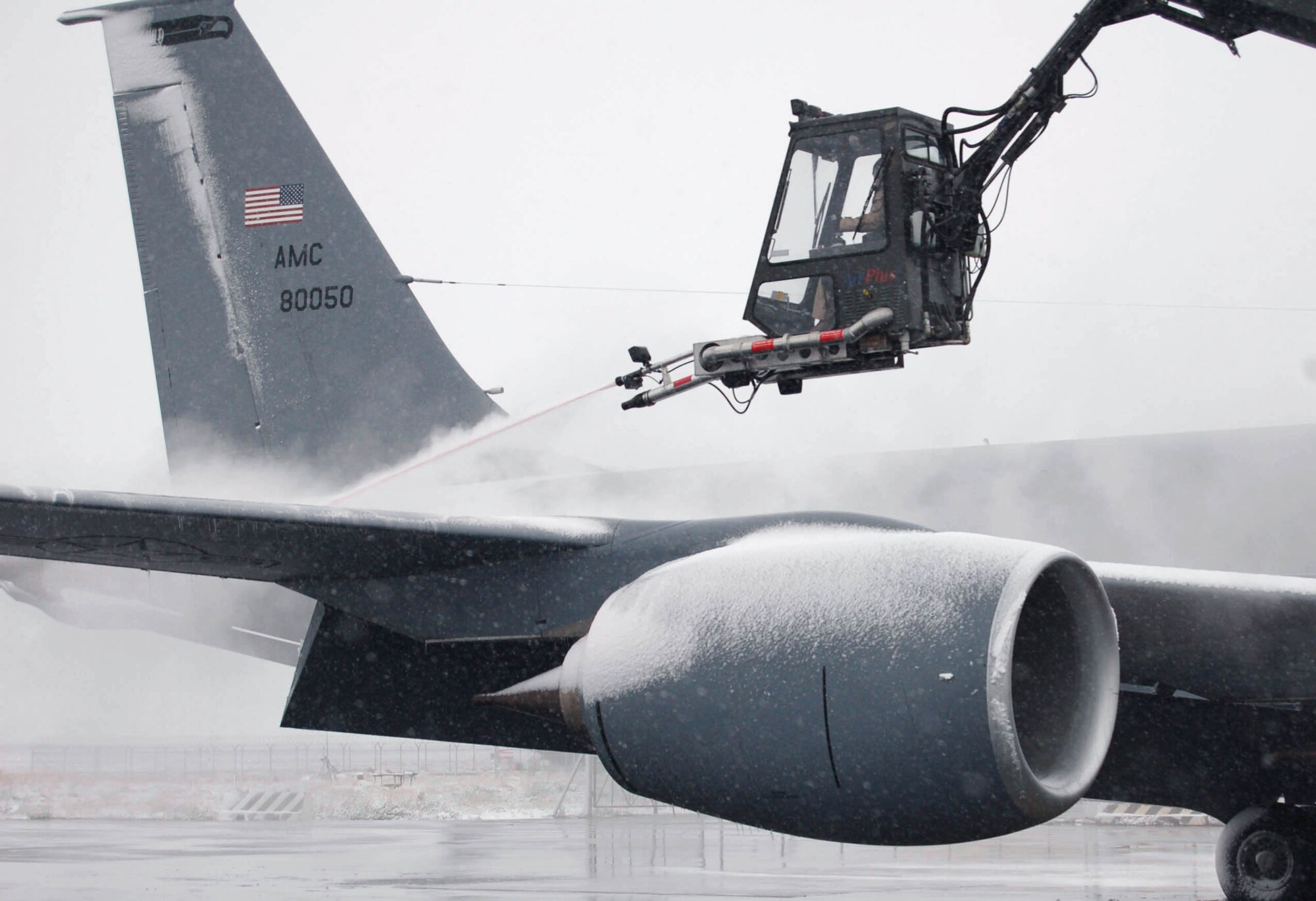 Senior Airman Ryan Saunders blasts the snow and ice off a KC-135 Stratotanker Nov. 21 at Manas Air Base, Kyrgyzstan, prior to the aircraft's next mission. This was the first snow of the season at Manas, home of the 376th Air Expeditionary Wing. The KC-135, deployed here from Fairchild Air Force Base, Wash., provides aerial refueling to aircraft flying over Afghanistan. Airman Saunders is deployed from the 92nd Aircraft Maintenance Squadron at Fairchild AFB. (U.S. Air Force photo/Master Sgt. Mitch Gettle)