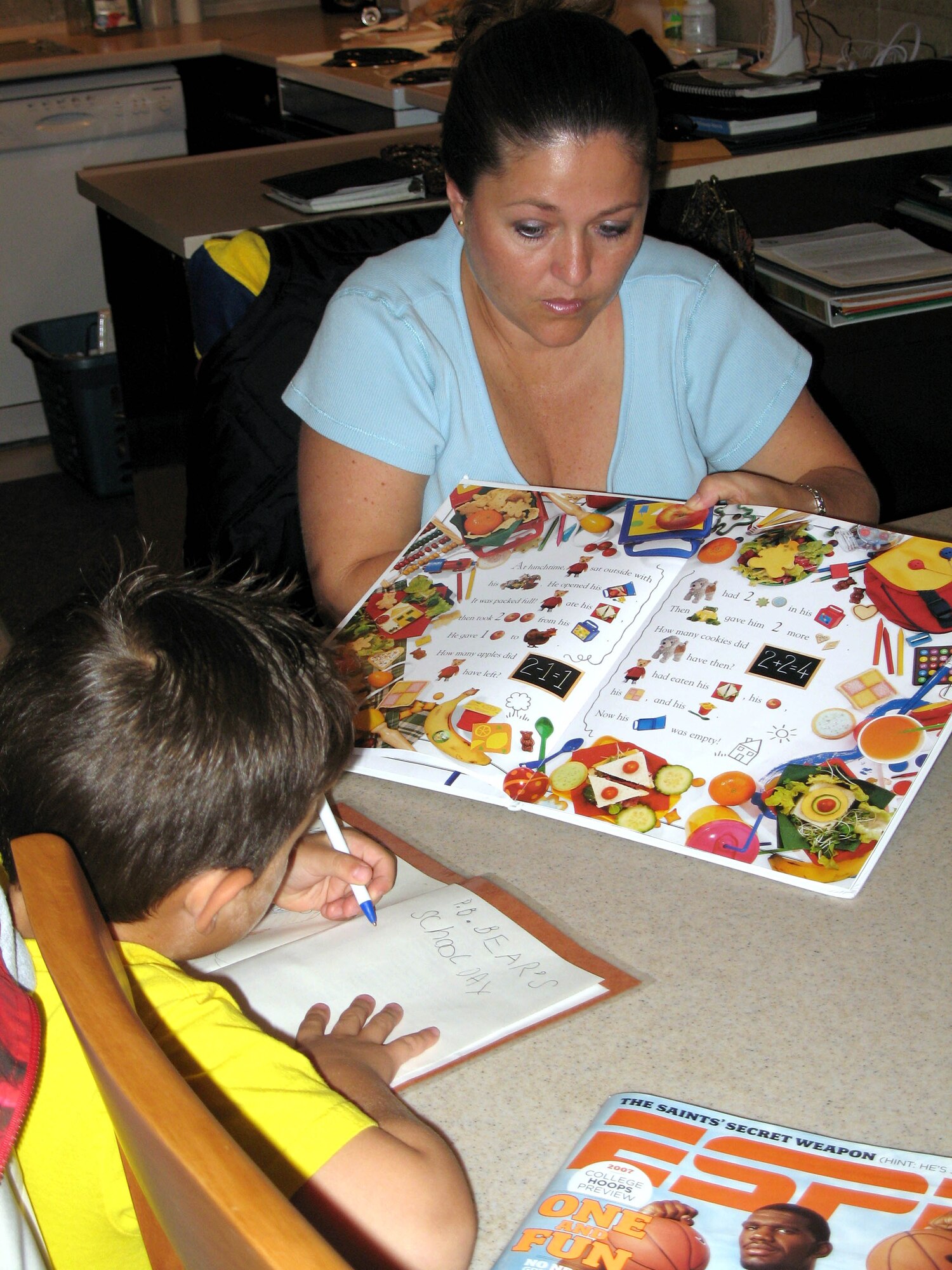 Brandi Ruiz, wife of Senior Master Sgt. Raul Ruiz, helps her son, Christian, with his homework.  The Ruiz family says it is very important to get involved with the base community and have done so at Incirlik Air Base, Turkey.  Sergeant Ruiz is the first sergeant for the 39th Security Forces Squadron there.  (U.S. Air Force photo/Staff Sgt. Courtney Donaldson)