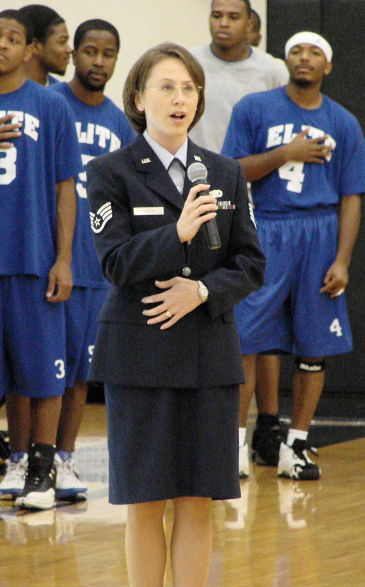 Staff Sgt. Cynthia Karch, 307th RED HORSE financial management specialist, sings the National Anthem at the Tyler Junior College basketball game Saturday, Nov. 11. (U.S. Air Force courtesy photo)