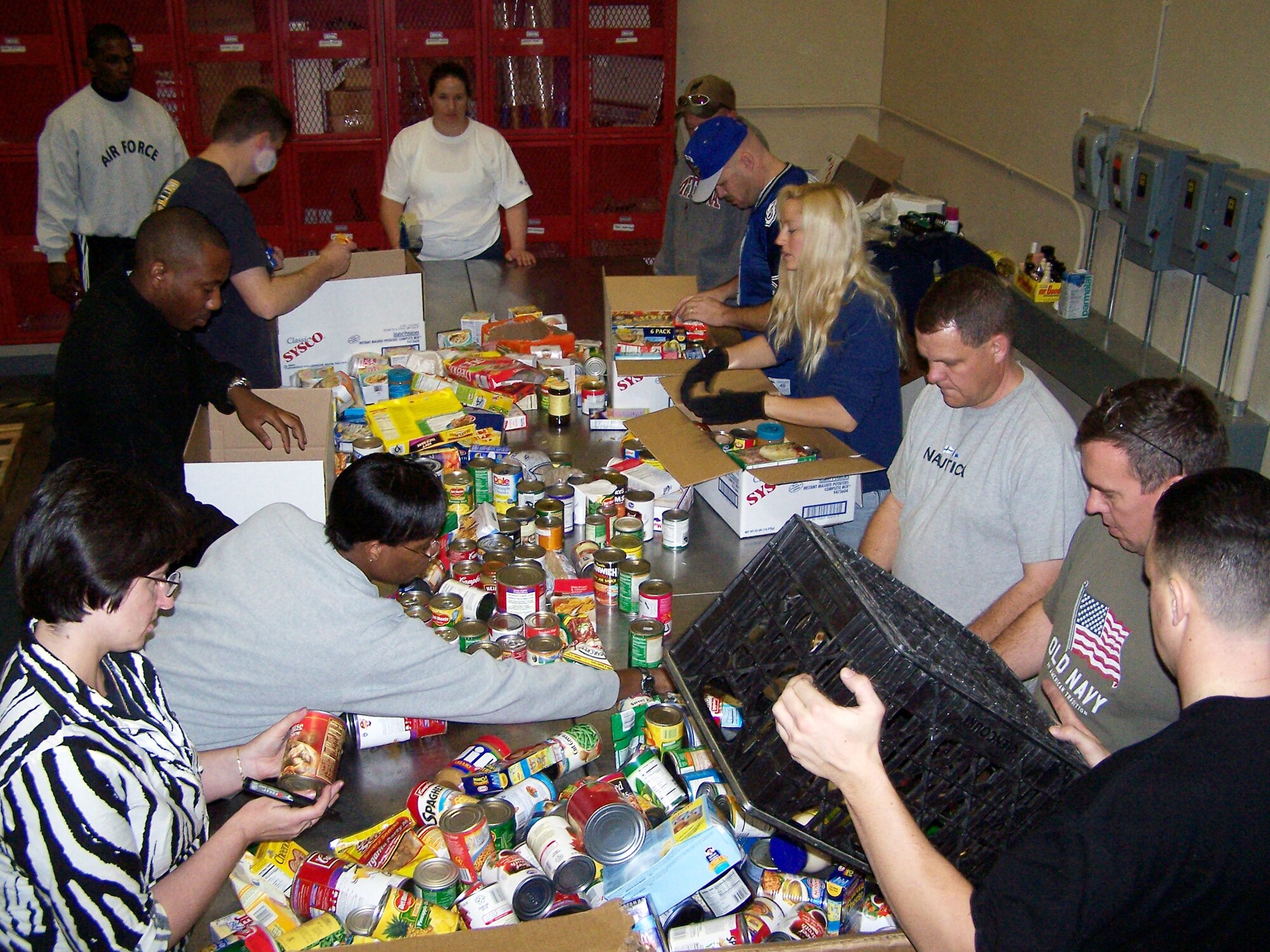 More than 400 volunteers from Peterson and surrounding bases volunteered for the annual Harvest of Love food drive at the Care and Share food bank Nov. 14 to 20. Over the course of five days, the volunteers picked up, sorted and packaged about 100,000 pounds of food. The food will be distributed to food banks across Southern Colorado. (U.S. Air Force photo by Steve Brady)