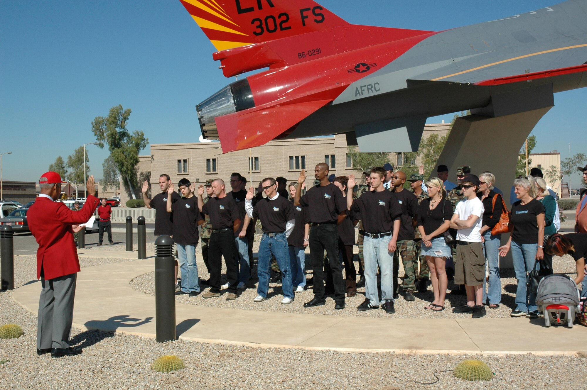Lt. Col. (ret.) Robert Ashby administers the oath of enlistment to 17 new recruits and many other 944th Fighter Wing members during a mass enlistment ceremony Oct. 16, 2006, at the Tuskegee Memorial Airpark at Luke Air Force Base. Colonel Ashby, an original Tuskegee Airman and resident of Sun City, Ariz., helped kick off the new recruiting year for the Air Force Reserve Command. The ceremony was part of a nationwide effort in October to boost recruiting throughout the reserve command. (U.S. Air Force photo/Staff Sgt. Susan Stout)