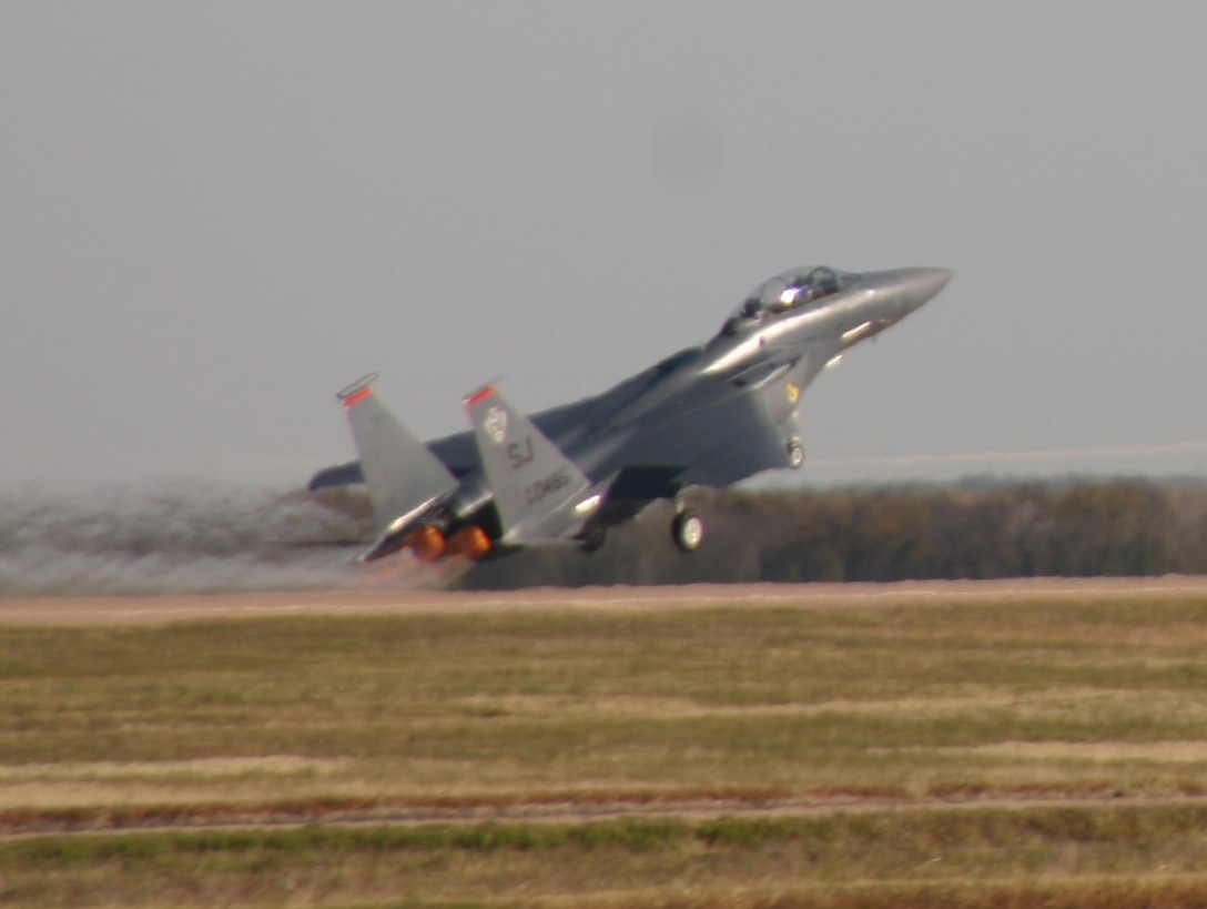 An F-15E Strike Eagle takes off Nov. 17 during the 80th Flying Training Wing's annual Combat Air Force Day. Student pilots from the wing, as well as Airmen-in-Training from the 82nd Training Wing, were able to take a close-up look at F-15s, F-16 Falcons, an A-10 Thunderbolt II, a B-1 Lancer, F-117 Nighthawk and German Tornado during the one-day event. (U.S. Air Force photo/John Ingle)