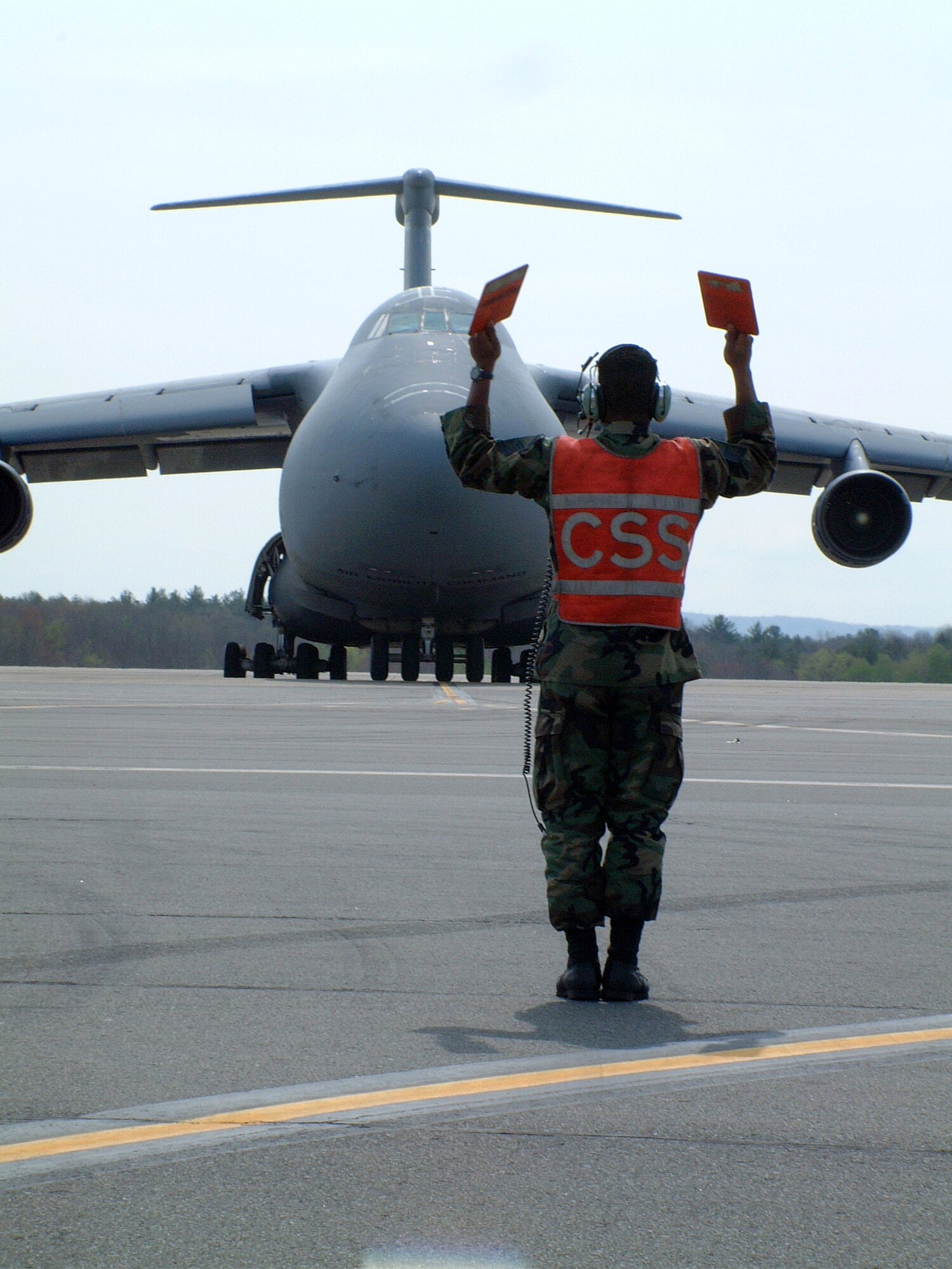 WESTOVER AIR RESERVE BASE, Mass. - A crew chief with the 439th Maintenance Group marshals a C-5 aircrew to a parking spot. The maintainers at Westover are responsible for the upkeep of 16 C-5s, the largest aircraft in the Air Force. The 439th Airlift Wing flies both the A and B models of the Galaxy, and supports Air Force strategic airlift objectives across the globe (US Air Force photo/Master Sgt. W.C. Pope).