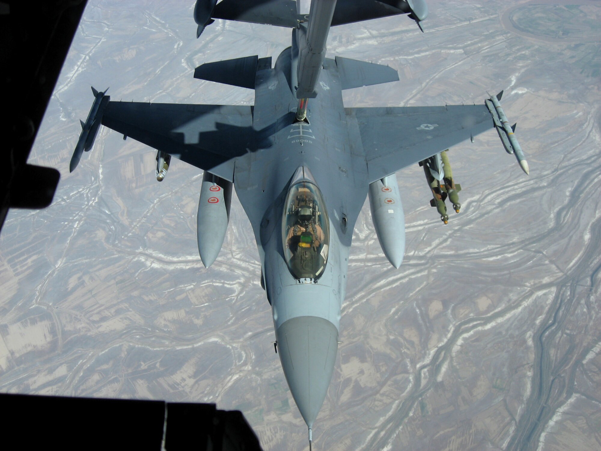 An F-16 Fighting Falcon from Balad Air Base, Iraq, takes fuel from a KC-10 Extender over Iraq Nov. 20. The KC-10 refueled two jets that afternoon in support of Operation Iraqi Freedom. The KC-10 aircrew is deployed in support of the 380th Air Expeditionary Wing. (U.S. Air Force photo/Capt. Justin T. Watson)