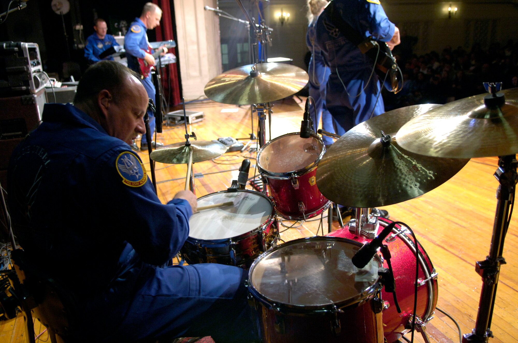 Senior Master Sgt. Scott Barbier plays the drums during a concert for students at Mamaroneck High School in New York, Nov. 22. Sergeant Barbier is part of the U.S. Air Force Academy Band, Blue Steel, which performed at the school in celebration of the Air Force's 60th Anniversary.  The band will also perform in the Macy's Thanksgiving Day Parade. (U.S. Air Force photo/Senior Airman Brian Ferguson)

