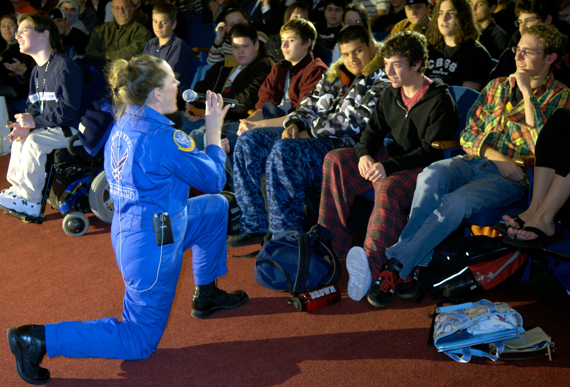 Tech. Sgt. Julie Bradley serenades students at Mamaroneck High School in New York, Nov. 22.  Sergeant Bradley is a member of the U.S. Air Force Academy Band, Blue Steel. The band's performance was just one of several concerts they will peform in New York throughout the holiday weekend. (U.S. Air Force photo/Senior Airman Brian Ferguson)
