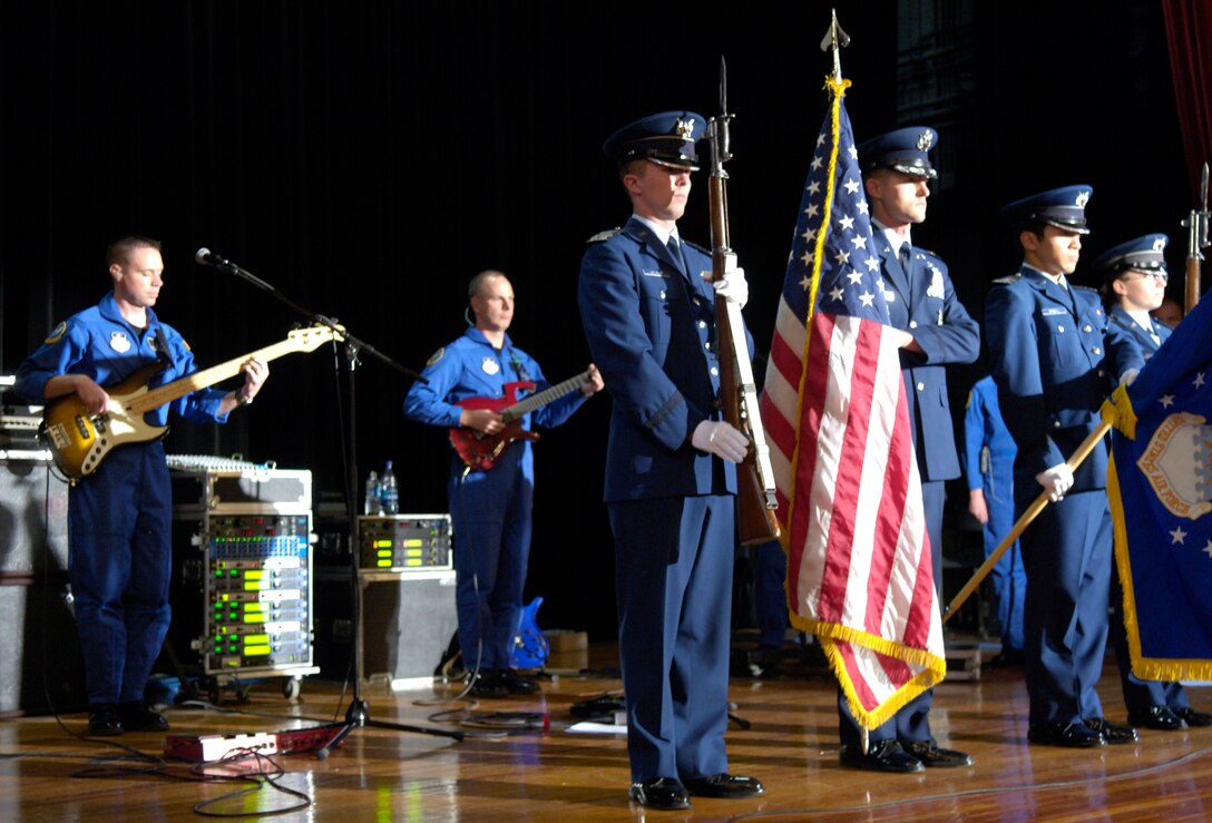 The U.S. Air Force Academy Honor Guard present the colors at Mamaroneck High School in New York, Nov. 22 as the Academy's band, Blue Steel, plays the National Anthem. Blue Steel performed a concert at the school as part of week-long events in New York celebrating the Air Force's 60th Anniversary.  The band will also perform in the Macy's Thanksgiving Day Parade and make an appearance on ABC's Good Morning America. (U.S. Air Force photo/Senior Airman Brian Ferguson)