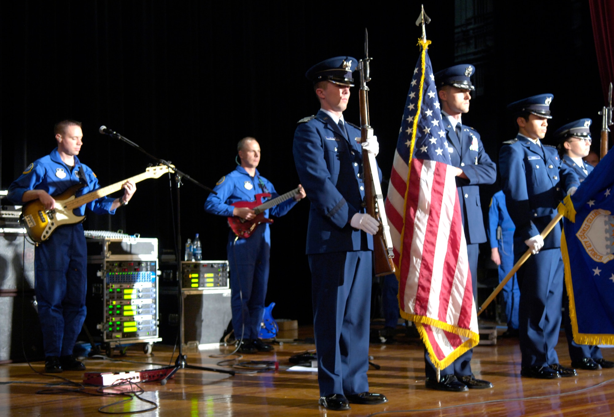 The U.S. Air Force Academy Honor Guard present the colors at Mamaroneck High School in New York, Nov. 22 as the Academy's band, Blue Steel, plays the National Anthem. Blue Steel performed a concert at the school as part of week-long events in New York celebrating the Air Force's 60th Anniversary.  The band will also perform in the Macy's Thanksgiving Day Parade and make an appearance on ABC's Good Morning America. (U.S. Air Force photo/Senior Airman Brian Ferguson)
