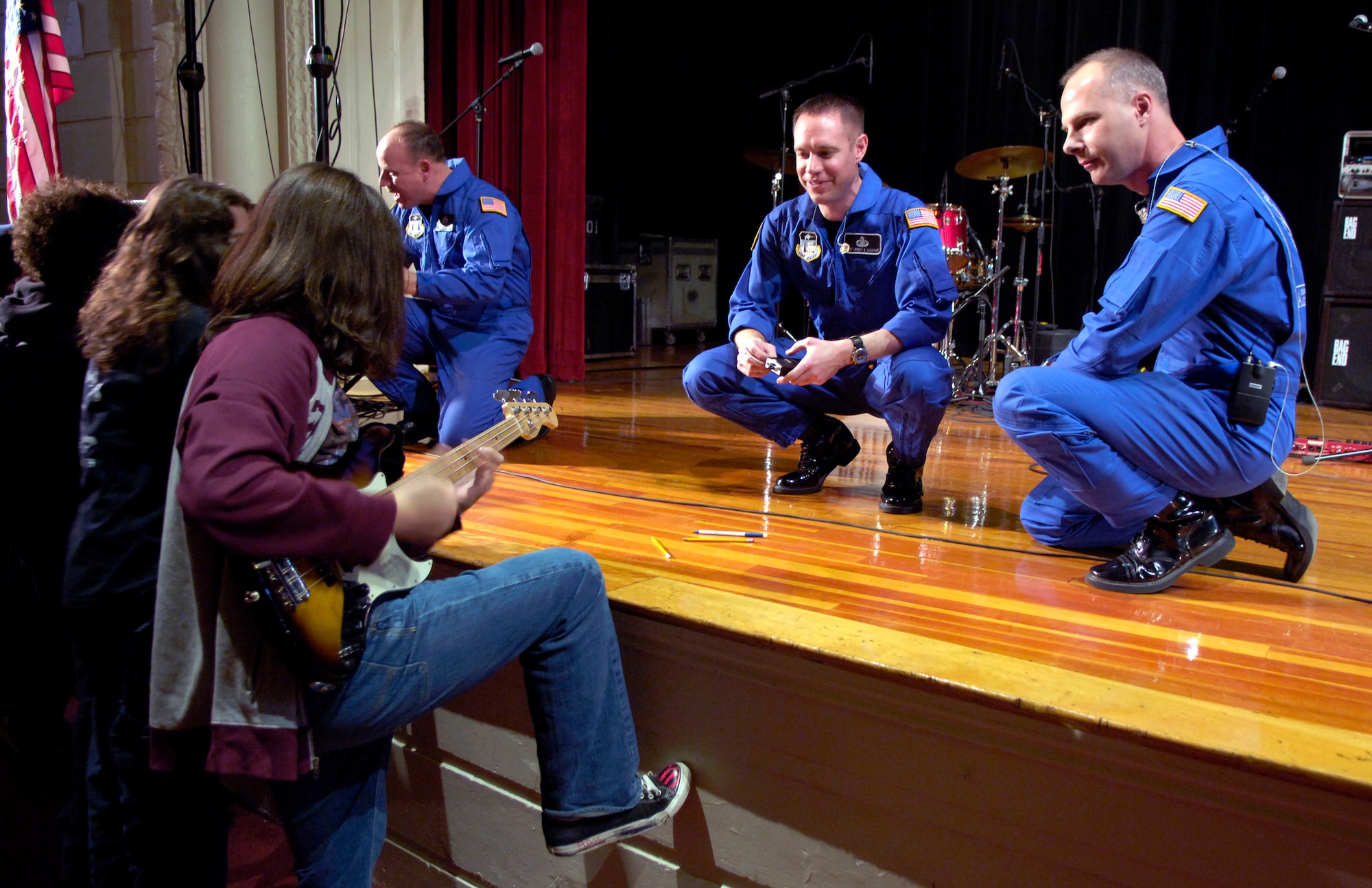 Master Sgt. Jeremy Laukhuf (left) and Tech. Sgt. Stephen Brannen talk with students from Mamaroneck High School in New York following a concert at the school Nov. 22.  The Airmen are members of the U.S. Air Force Academy Band, Blue Steel. The performance was in celebration of the Air Force's 60th Anniversary. (U.S. Air Force photo/Senior Airman Brian Ferguson)
