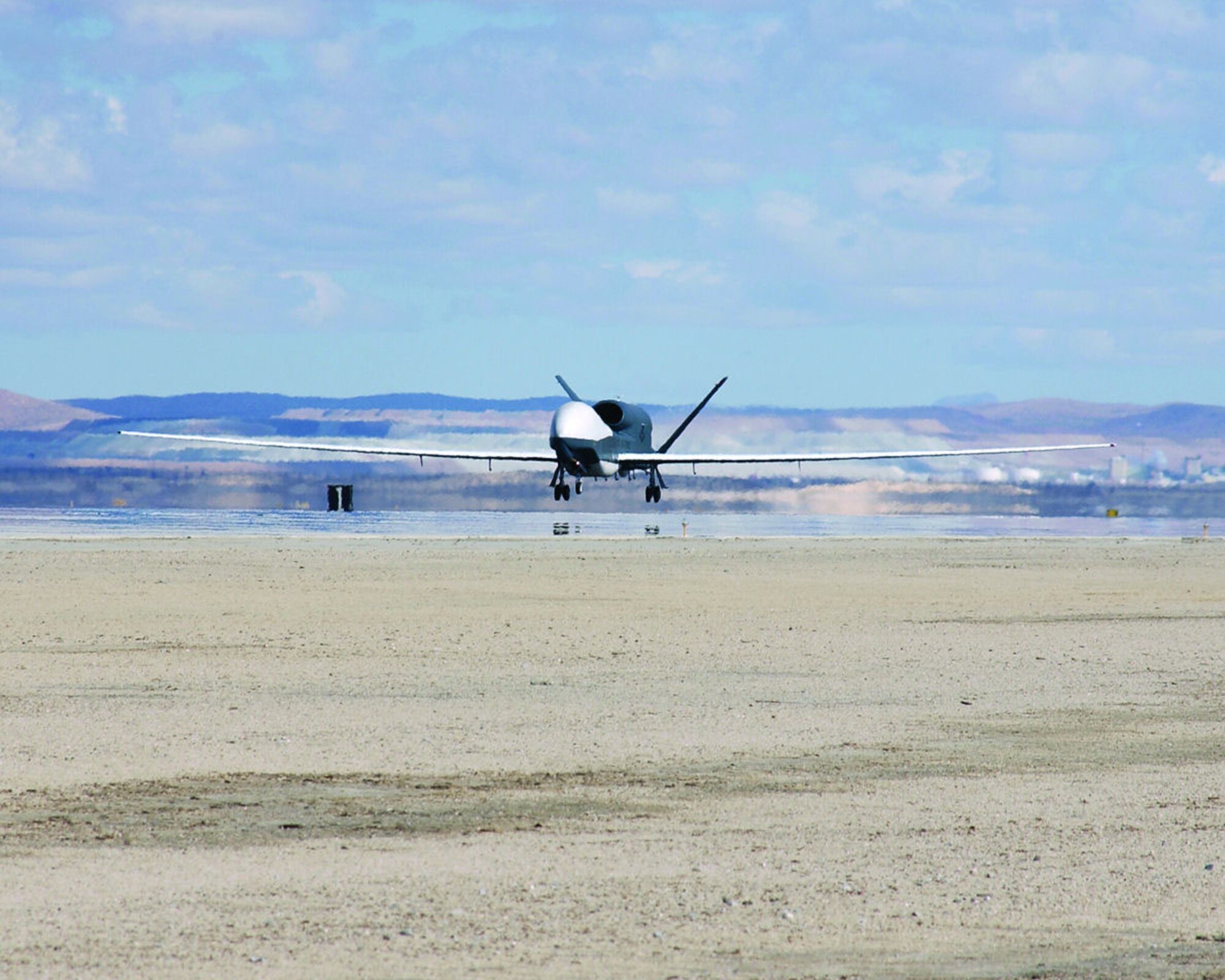 Global Hawk Unmanned Aerial Vehicle No. 3 (UAV-3) lands at Edwards on Feb. 22, 2006, after flying more than 4,800 hours in support of Operation Iraqi Freedom. (Photo by Chad Bellay)