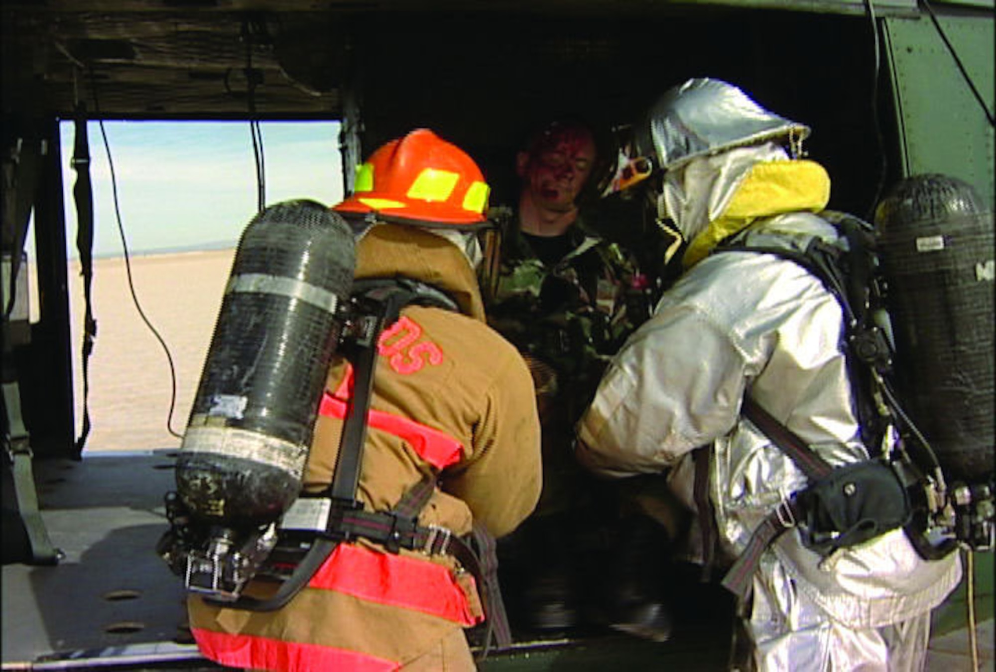 Space Shuttle Recovery Teams rescue the crew of a 'downed' helicopter during a NASA shuttle exercise Feb. 4, 2006. A variety of emergency scenarios were interjected during the exercise to test communication between Battlestaff and the Shuttle Recovery Team.  (Photo by Mark McCoy)