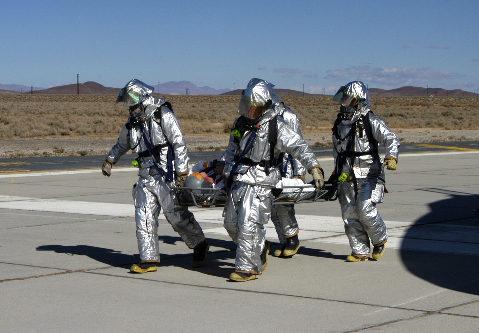 Search and recovery specialists practice rescuing 'injured astronauts' during a space shuttle exercise in November 2003. Hundreds of people from various Edwards organizations are directly tasked with supporting NASA's successful shuttle landing and departure.  (Photo by Senior Airman Jet Fabara)