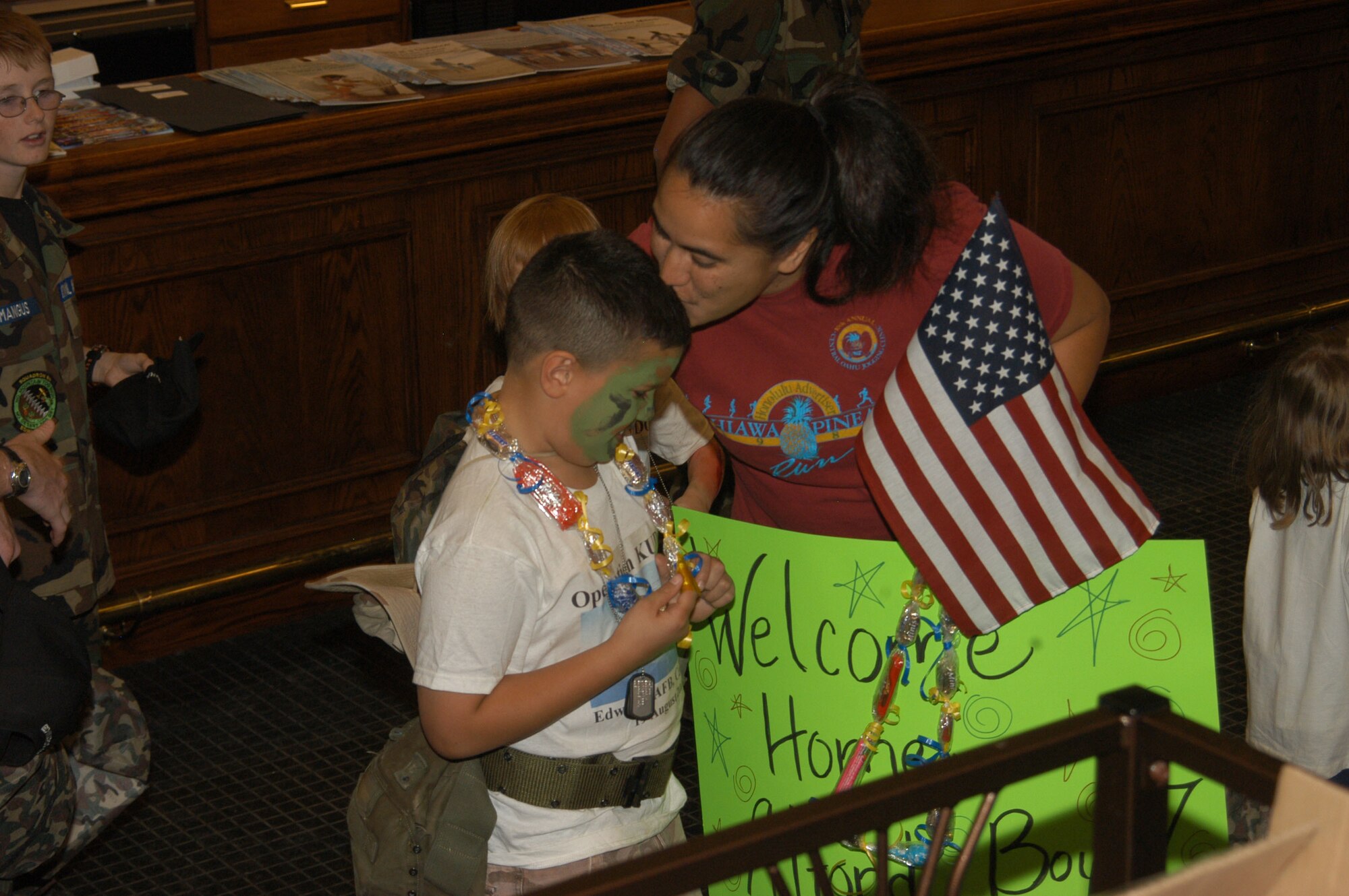 Lupe Alford welcomes home her son Elijah Alford, 7, from his mock deployment at Camp Raven.  (Photo by Airman Stacy Garcia)