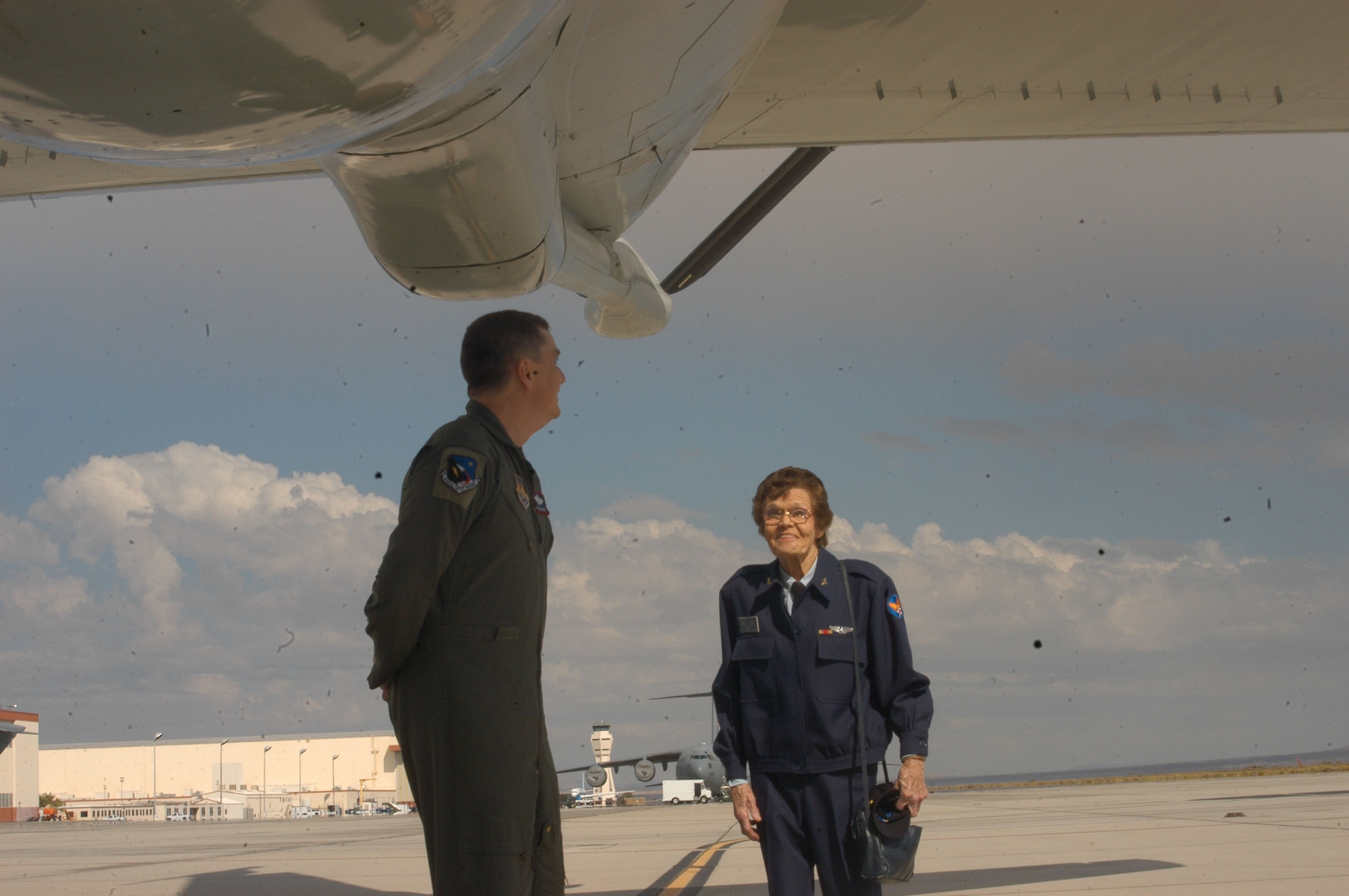 Master Sgt. Craig Eyre, 445th Flight Test Squadron, shows Margueritte Hughes Killen, former Women's Airforce Service Pilot, the KC-135 Stratotanker. (Photo by Airman Stacy Garcia)