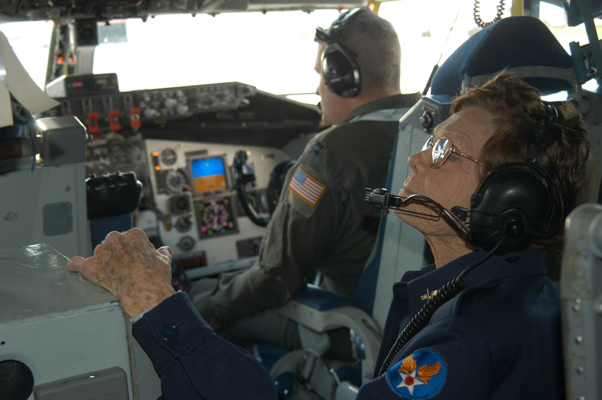 Margueritte Hughes Killen, former Women's Airforce Service Pilot, observes the cockpit while on board a KC-135 Stratotanker. The 445th Flight Test Squadron invited Ms. Killen to fly with them during a sortee here Oct. 13, 2006.  (Photo by Airman Stacy Garcia)