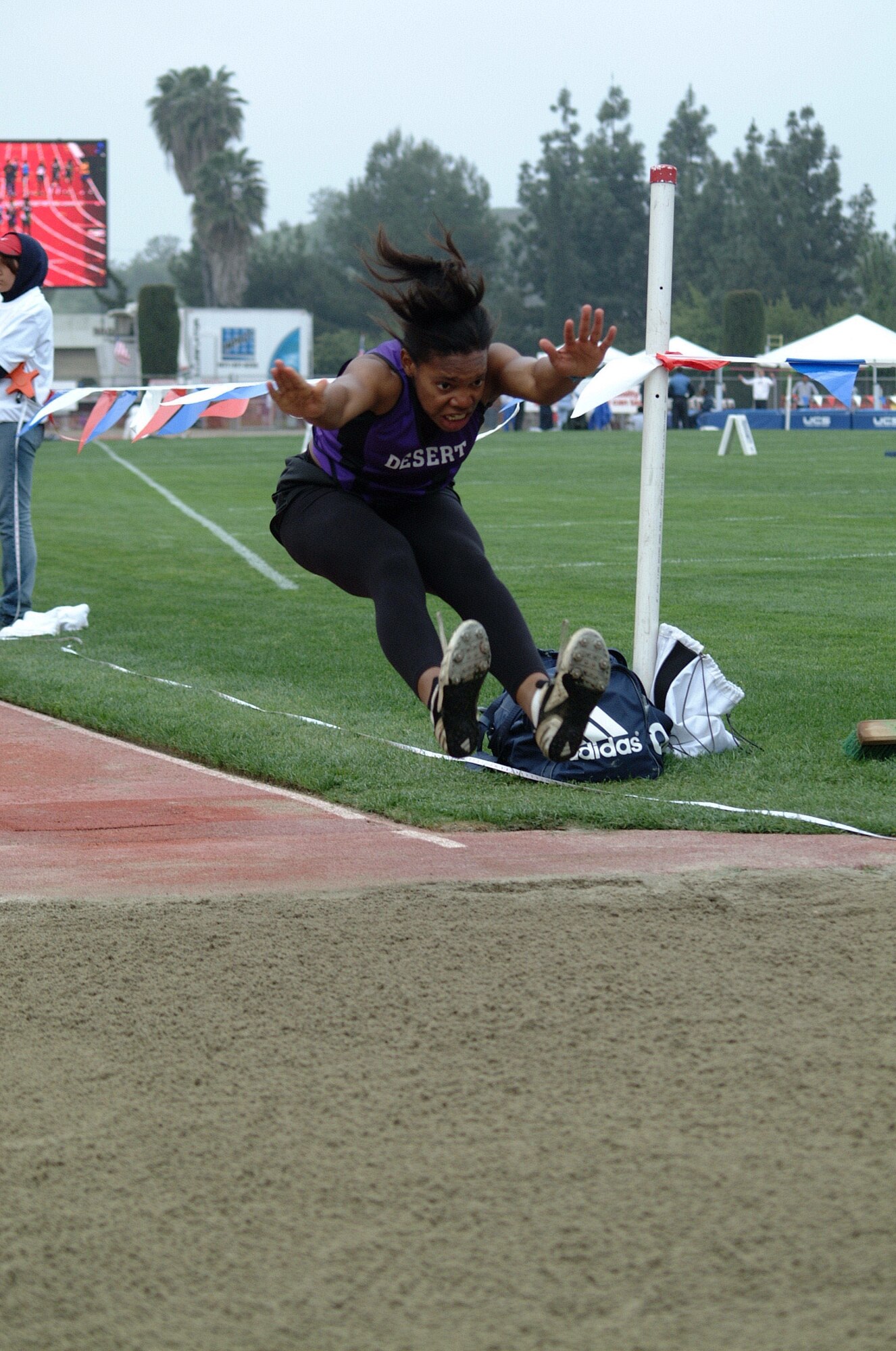 Desert High Senior R.D. Hicks, 17, competes in the triple jump event at the Arcadia Invitational in April 2006. Hicks is ranked number one in the High Desert League in all four of her events, triple jump, long jump, the 100 meter and 200 meter dash. She is also ranked sixth overall in California for the triple jump. (Photo by Alisha Tampon)
