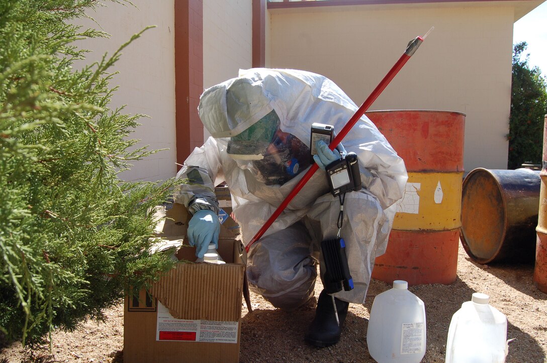 Senior Airman Wayne General, 411th Flight Test Squadron weapons load crew member, measures readouts of hazardous samples as part of a flightline HAZMAT training exercise.  (Photo by Airman 1st Class Julius Delos Reyes)