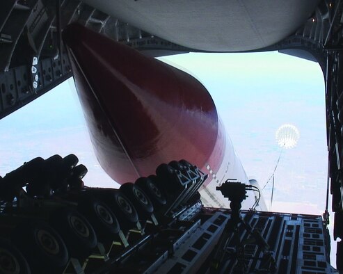 A Falcon Small Launch Vehicle is released from a C-17 Globemaster III here June 14, 2006. The Falcon SLV project, a joint venture between the Defense Advanced Research Projects Agency and the Air Force, is designed to develop a new method for putting satellites into low-earth orbit. The 32.5-ton test vehicle is the heaviest object ever dropped from a C-17.  (Photo by Steve Zapka)