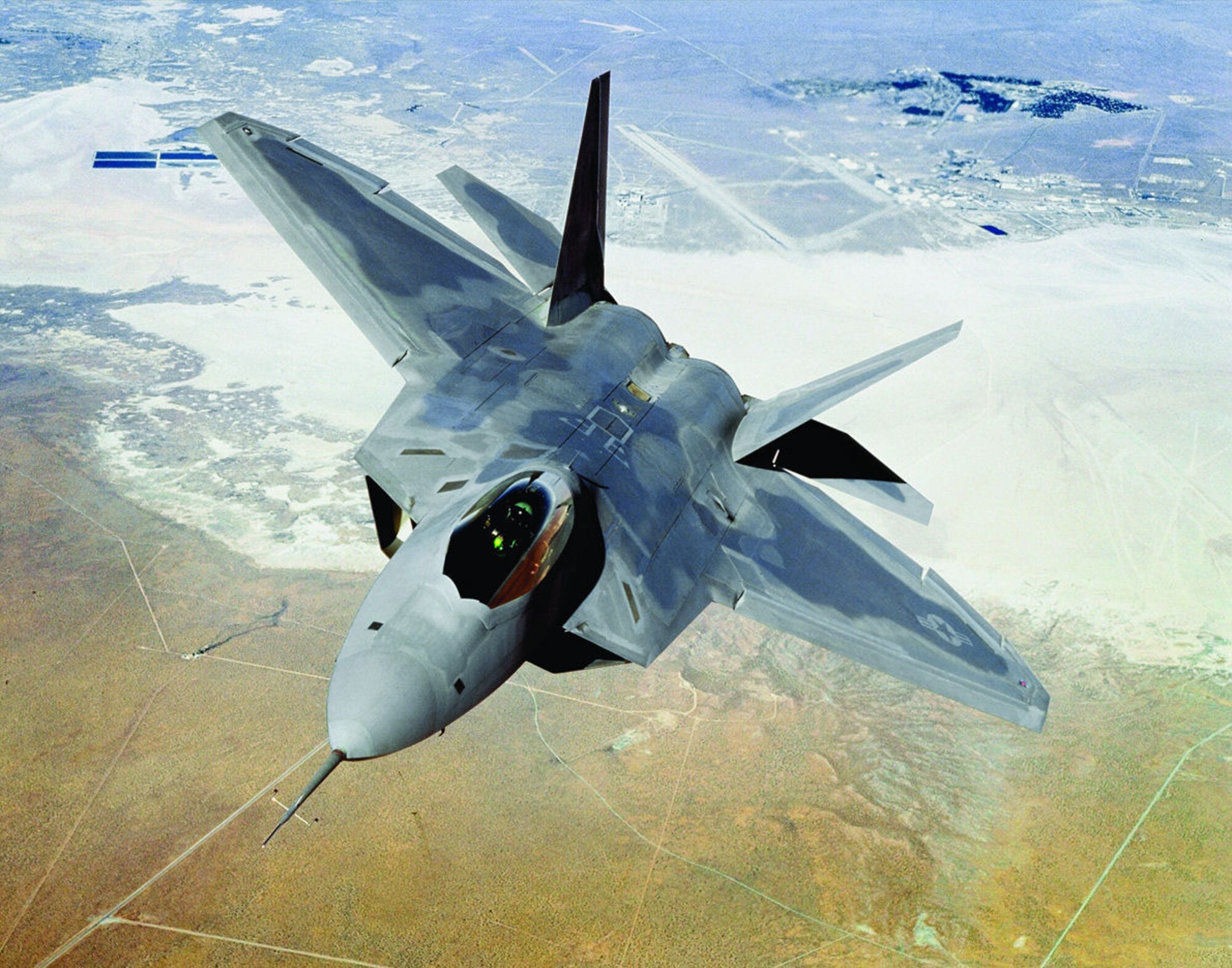 An Edwards F-22A Raptor flies over the Rogers Dry Lakebed here in this undated file photo. (Courtesy photo)