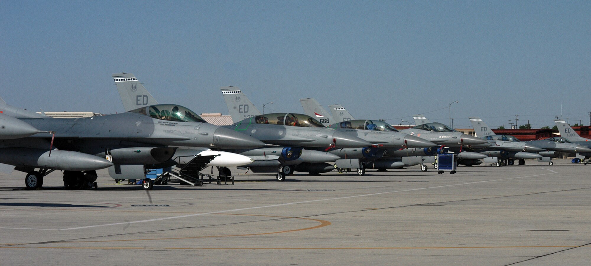 Maj. Sherman Kearl, 416th Flight Test Squadron F-16 pilot, prepares for his early-morning flight, July 4, 2006, in support of local Fourth of July festivities. Edwards' support of Southern California flyovers included three more pilots and more than 40 maintainers and support personnel.  (Photo by Senior Airman Francesca Carrano)