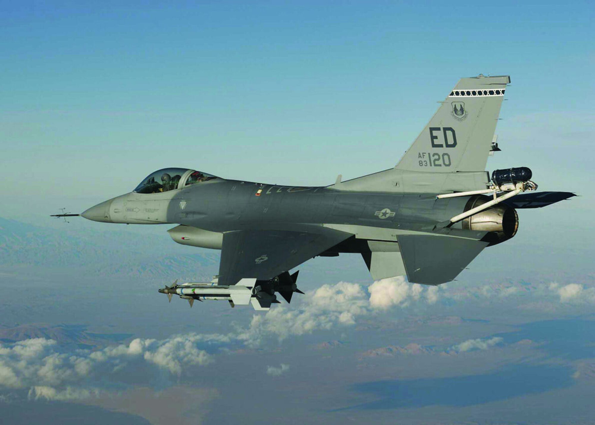 An F-16 from the 416th Flight Test Squadron tests a replacement pylon designed to carry towed decoys for the Taiwan Air Force. The Taiwan High Angle of Attack program was rolled into Edwards' Operational Readiness Exercise, Feb. 27 through March 3, 2006, to prove the squadron's capability to "test surge" in support of real-world Global War on Terror requirements.  (Photo by Tom Reynolds)