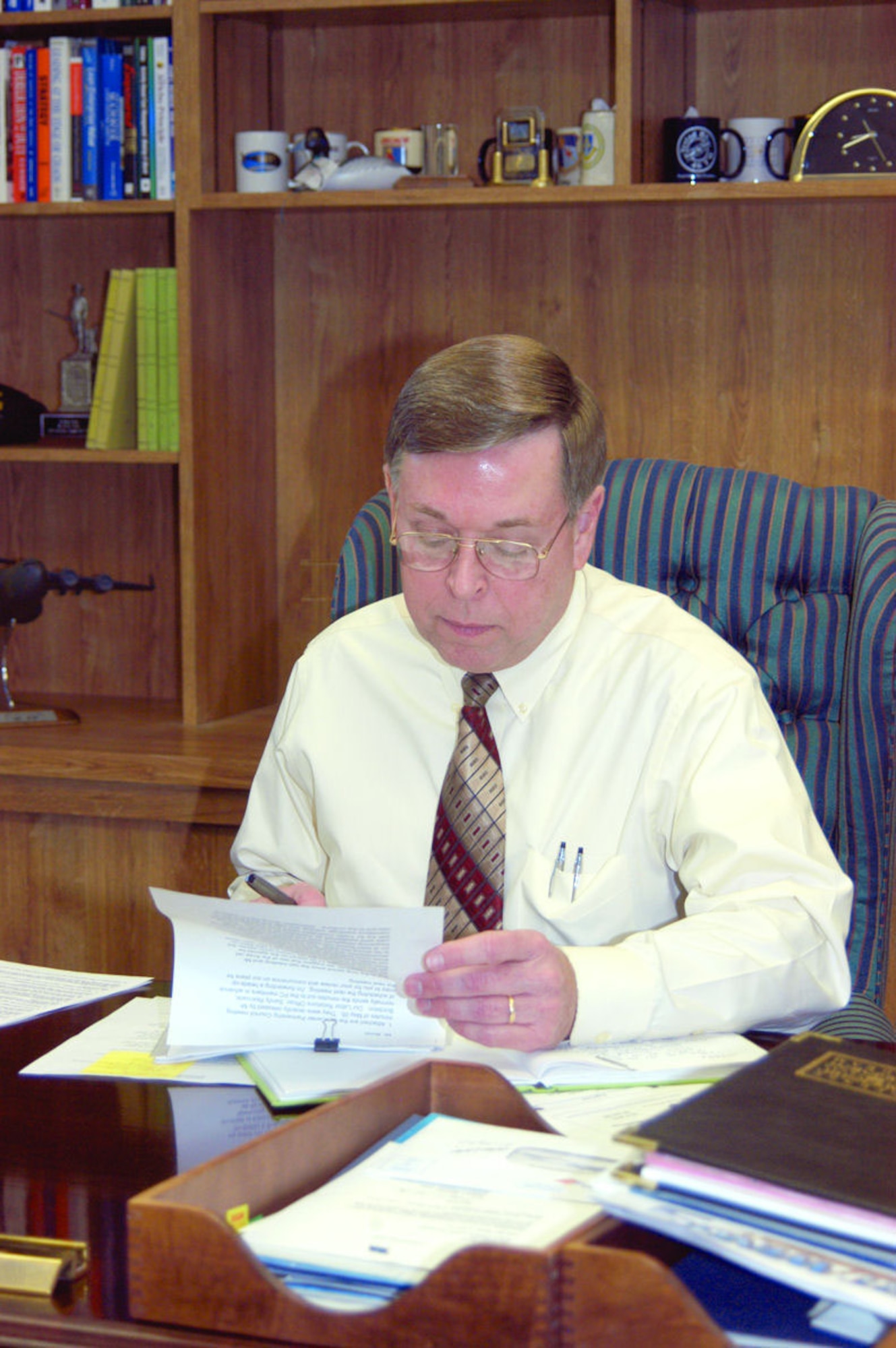 David Bond, Air Force Flight Test Center executive director, works at his desk.  (Photo by Senior Airman Francesca Carrano)