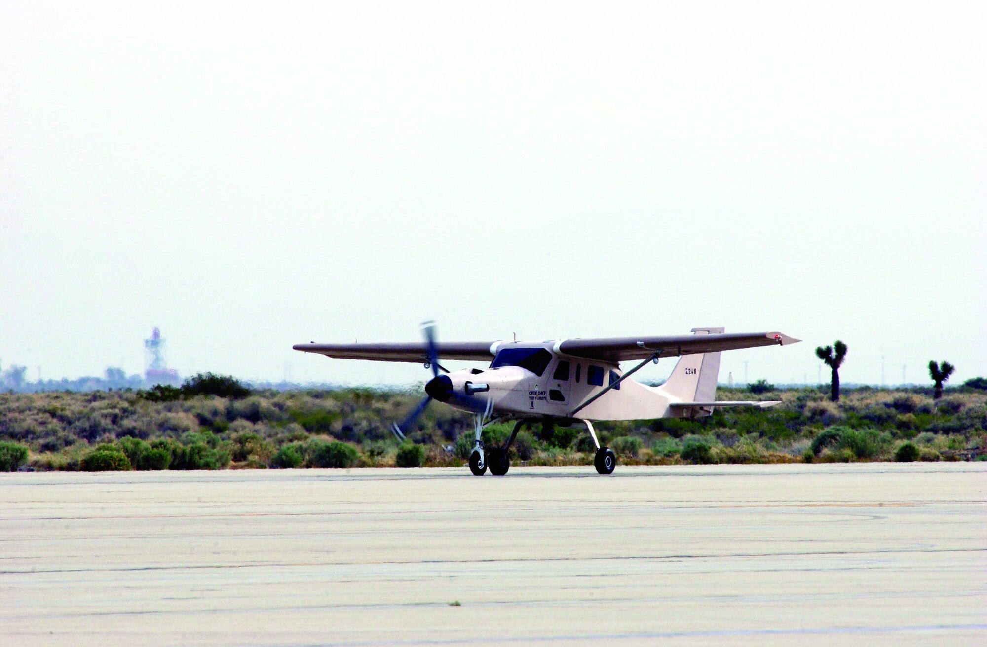 An Iraqi Air Force Comp Air 7SLX touches down on the main runway here after successfully completing its initial flight test Tuesday. A combined team from Edwards, Robins Air Force Base, Ga., Hill AFB, Utah, and Tinker AFB, Okla., spent two months preparing, stripping down and rebuilding the aircraft. (Photo by Jet Fabara)