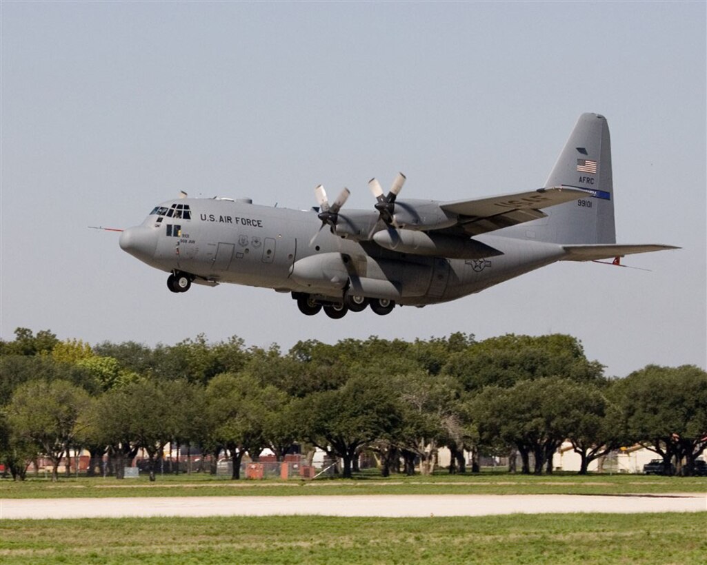 The first C-130 Avionics Modernization Program aircraft lifts off the runway at Lackland Air Force Base, Texas, on its maiden flight Sept. 19, 2006.  (Photo by Rich Rau)