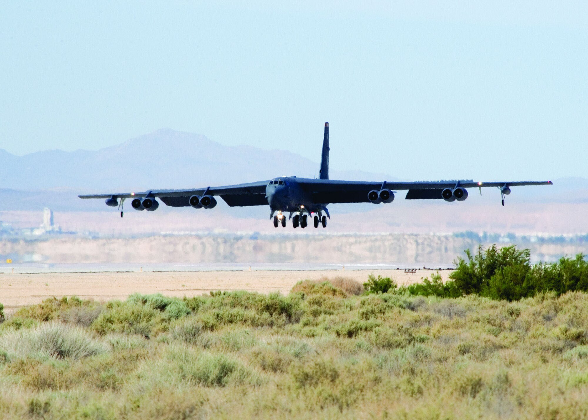A B-52 Stratofortress touches down on Edwards' main runway June 5, 2006, to undergo testing on a synthetic fuel. Before testing can begin, the aircraft's engines will be modified with instrumentation to measure key engine pressures, temperatures and physical characteristics like fuel flow. This will allow testers to determine if the new F-T fuel has changed the operating characteristics of the engine. The first on-aircraft engine runs with F-T fuel are planned to take place in early September. These runs are expected to take two weeks, followed by another two weeks of flight testing by the 419th Flight Test Squadron. (Photo by Chad Bellay)